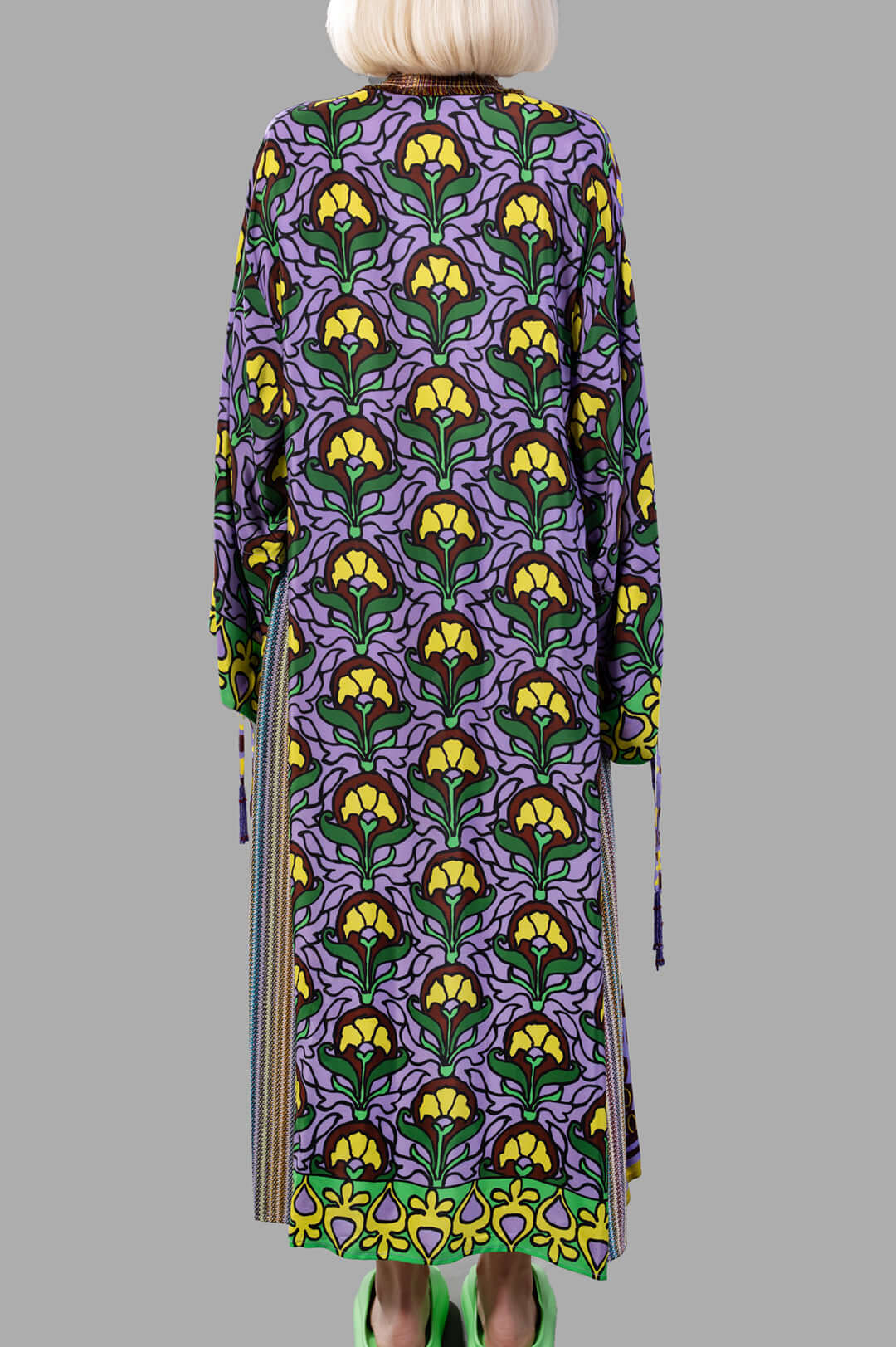 Anjuna Embellished Printed Crepe Kaftan features a vibrant floral design, shown from the back with tassel details.
