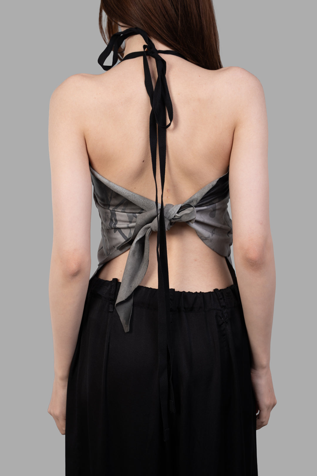 Giovanni Cavagna Gradient-print Top displayed from the back, showcasing elegant tie detailing in grey leather.