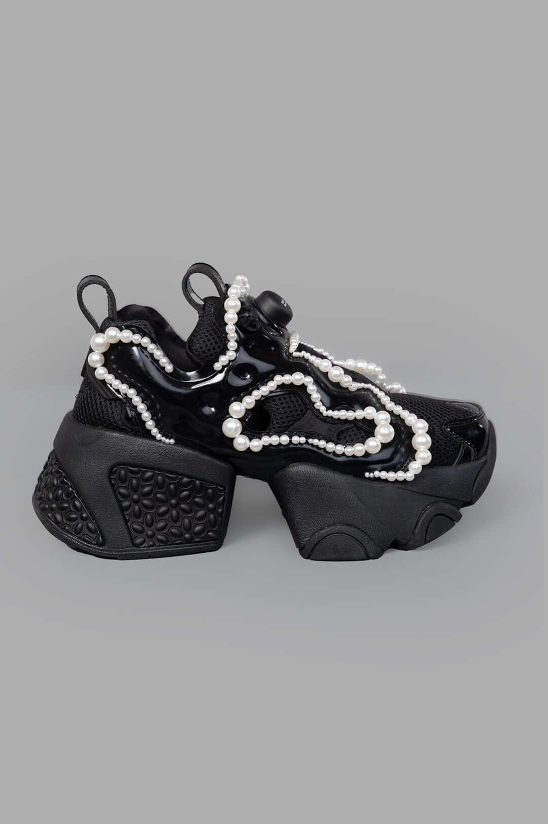 Noir Kei Ninomiya x Reebok Pearl-embellished Sneakers; side view with black upper and contrasting pearl detailing.