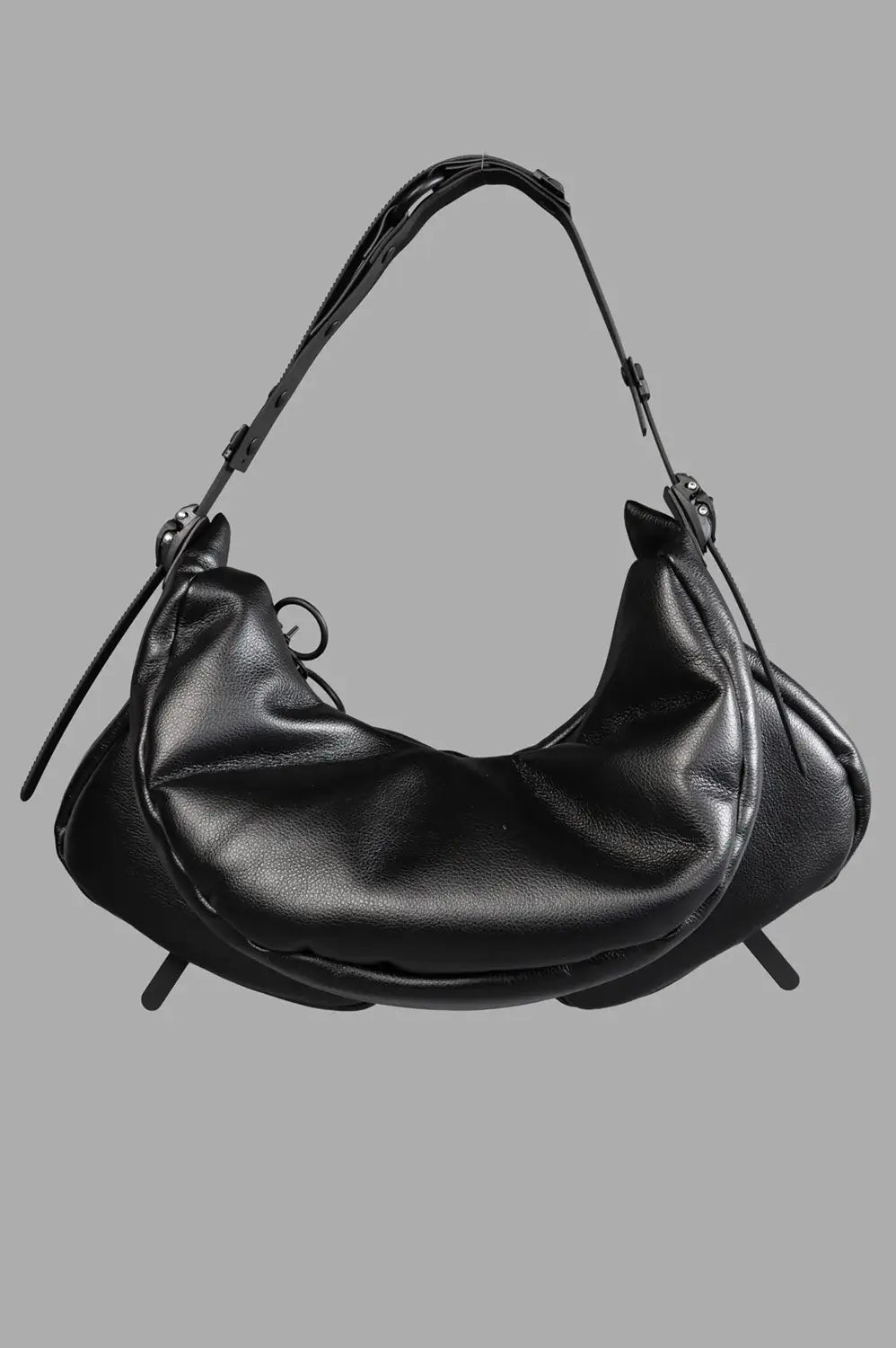Back close-up with smooth padded panel, adjustable handle and side strap hardware.