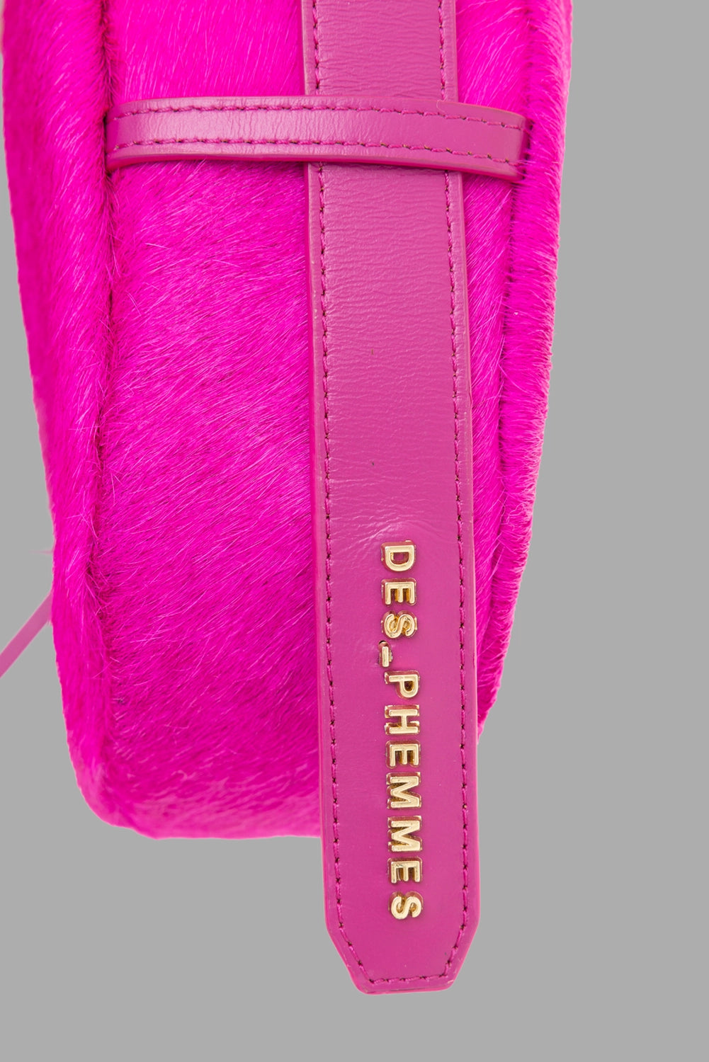 Des Phemmes women's small hobo bag in Framboise, logo detail, gold DES PHEMMES lettering on strap edge.