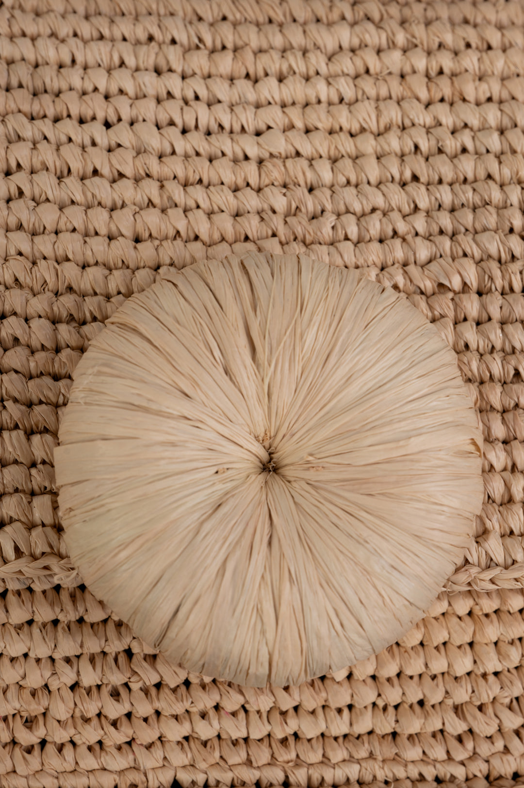 By Malene Birger Miro Shoulder Bag close-up of large floral appliqué detail on natural raffia texture. Perfect for summer.