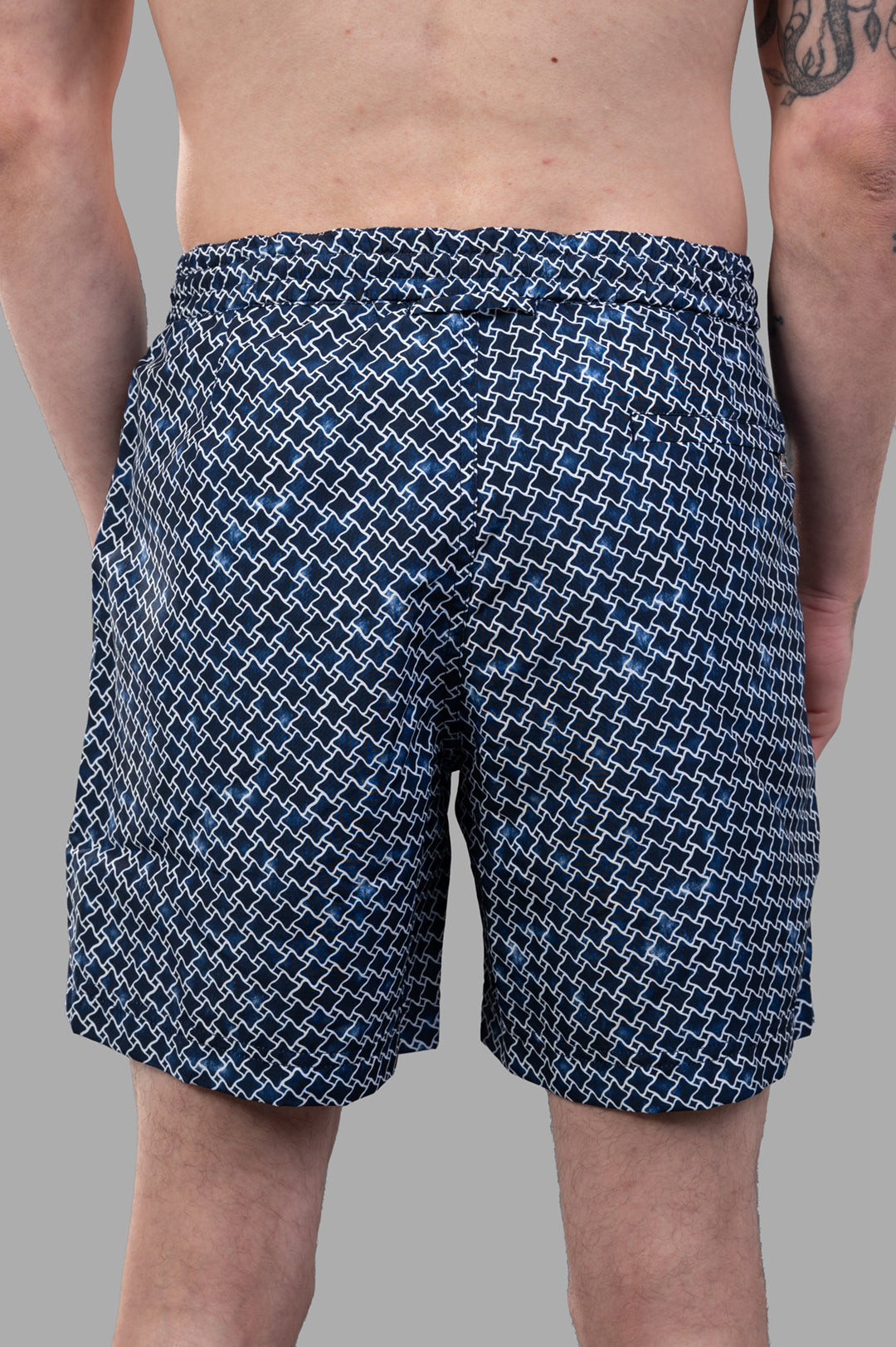 Orlebar Brown Geo Print Drawcord Swim Shorts shown from the back, highlighting the relaxed fit and unique blue pattern.