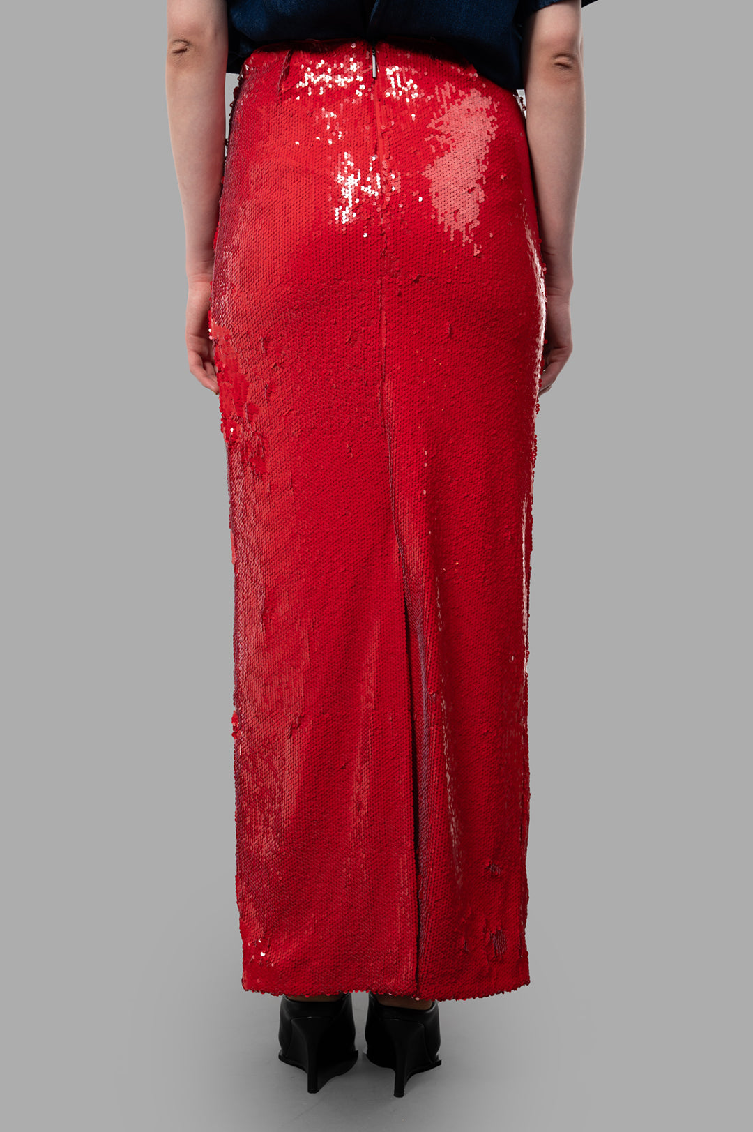 MSGM Red Sequin Skirt showcased from the back, featuring a form-fitting silhouette and shimmering sequins for a bold look.