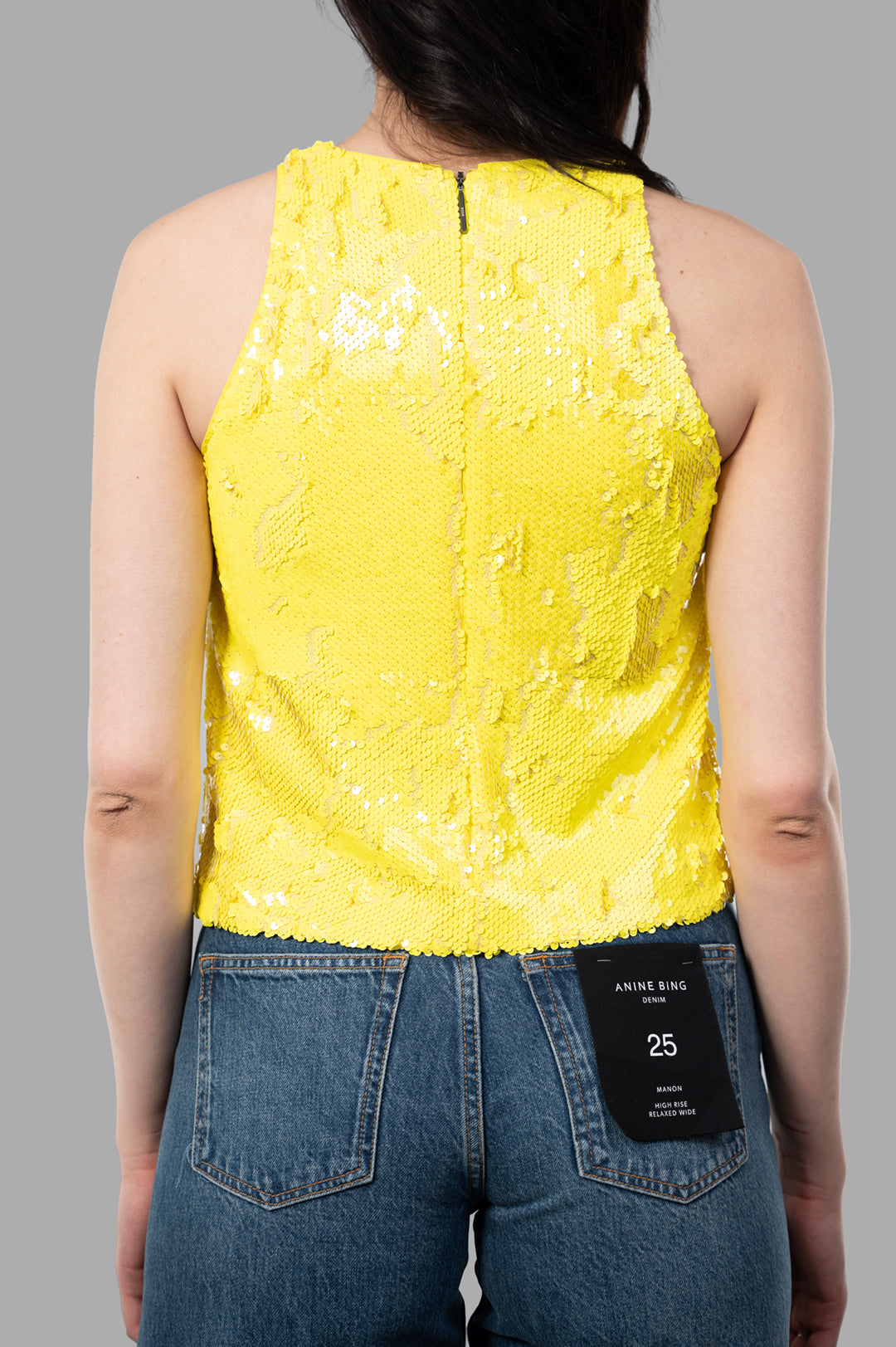 MSGM Yellow Sequin Top showcased from the back, featuring a dazzling texture and a near-fitted silhouette.