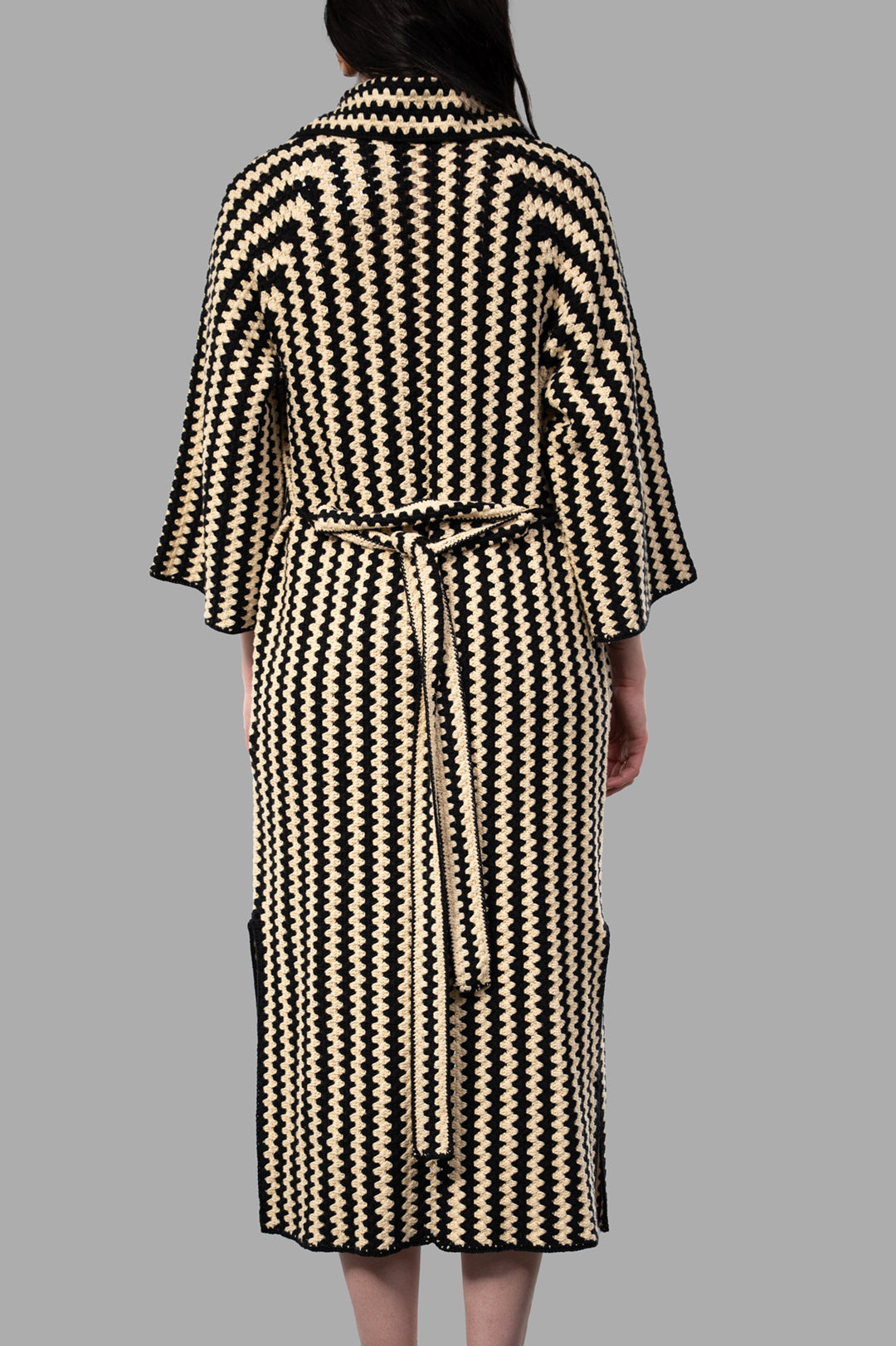 By Malene Birger Dina Organic Cotton Coat in beige/black, featuring chunky crochet, longline design, and detachable belt.