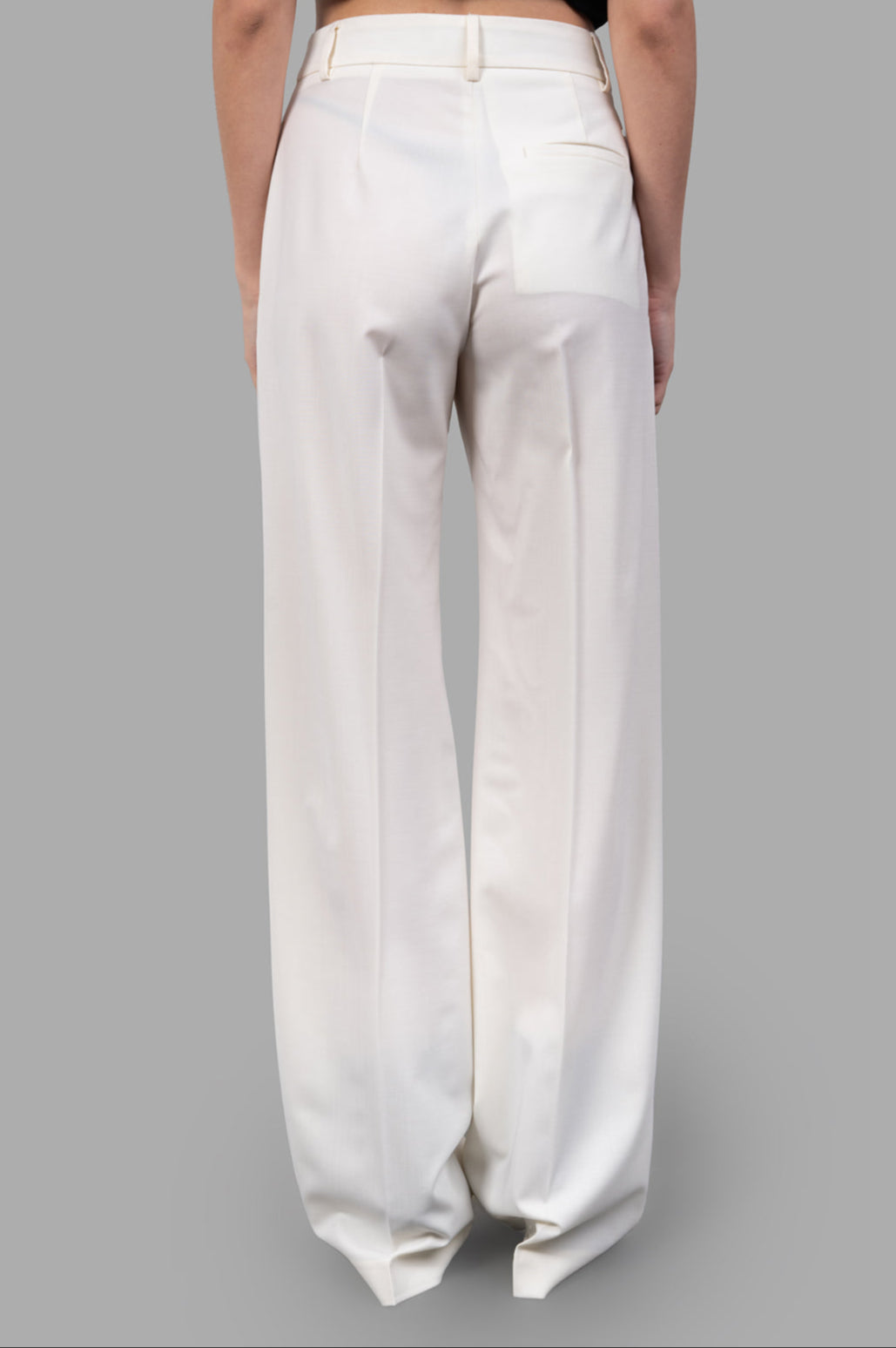 MSGM Wide-leg Trousers rear view showcasing tailored design, classic pleats, and soft ecru fabric for refined elegance.