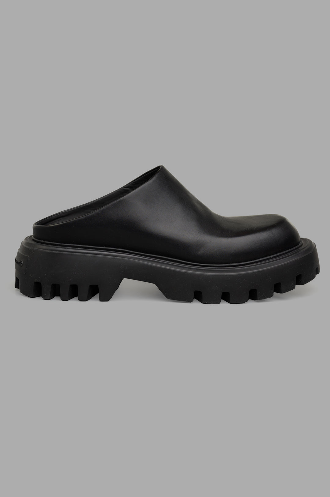 Mattia Capezzani Leather Mules, side view of black, sculptural Italian design with chunky sole.