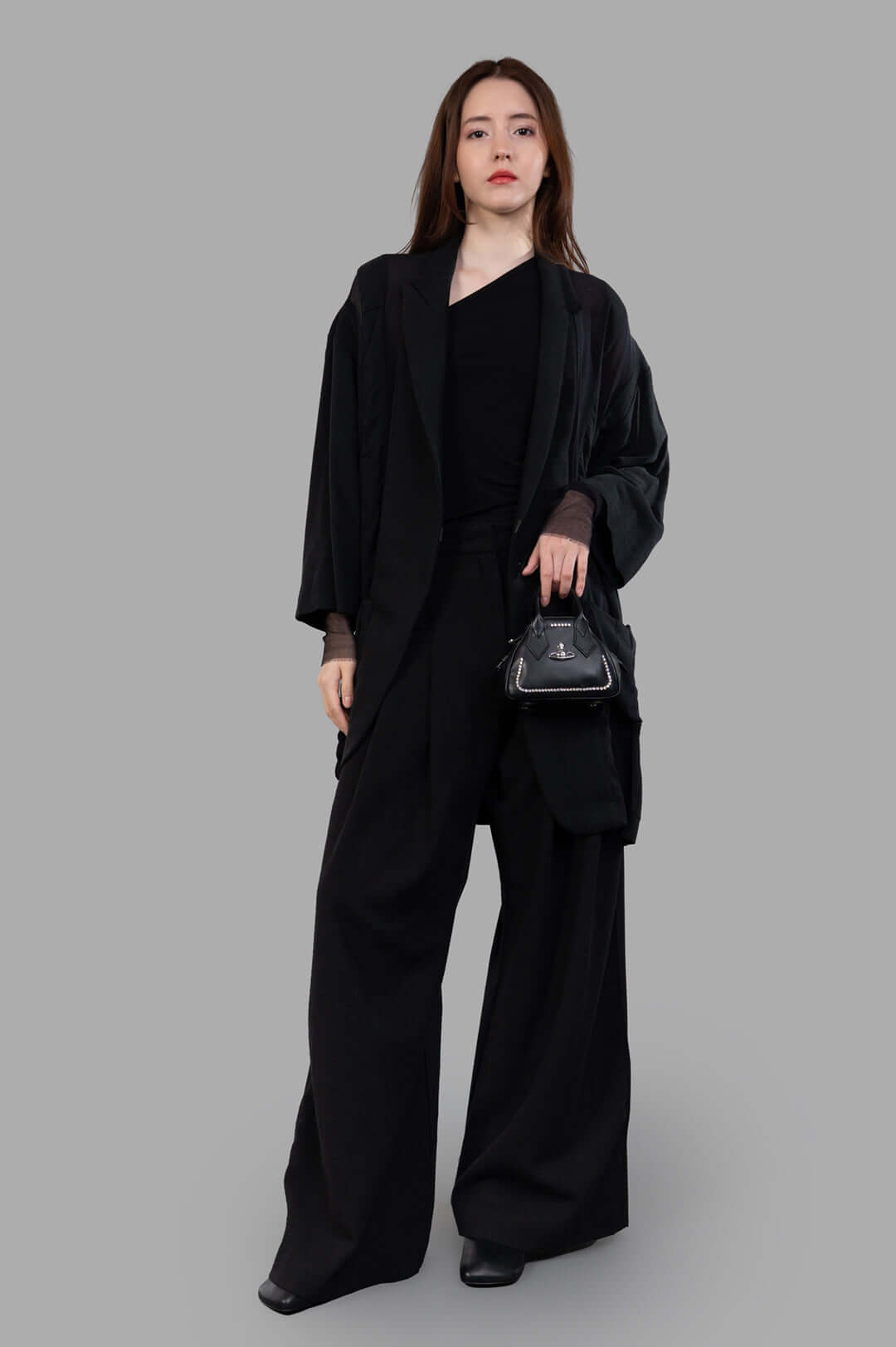 Giovanni Cavagna Paneled Blazer, black, front view on model, 70% cotton, 30% silk, showcasing innovative design.