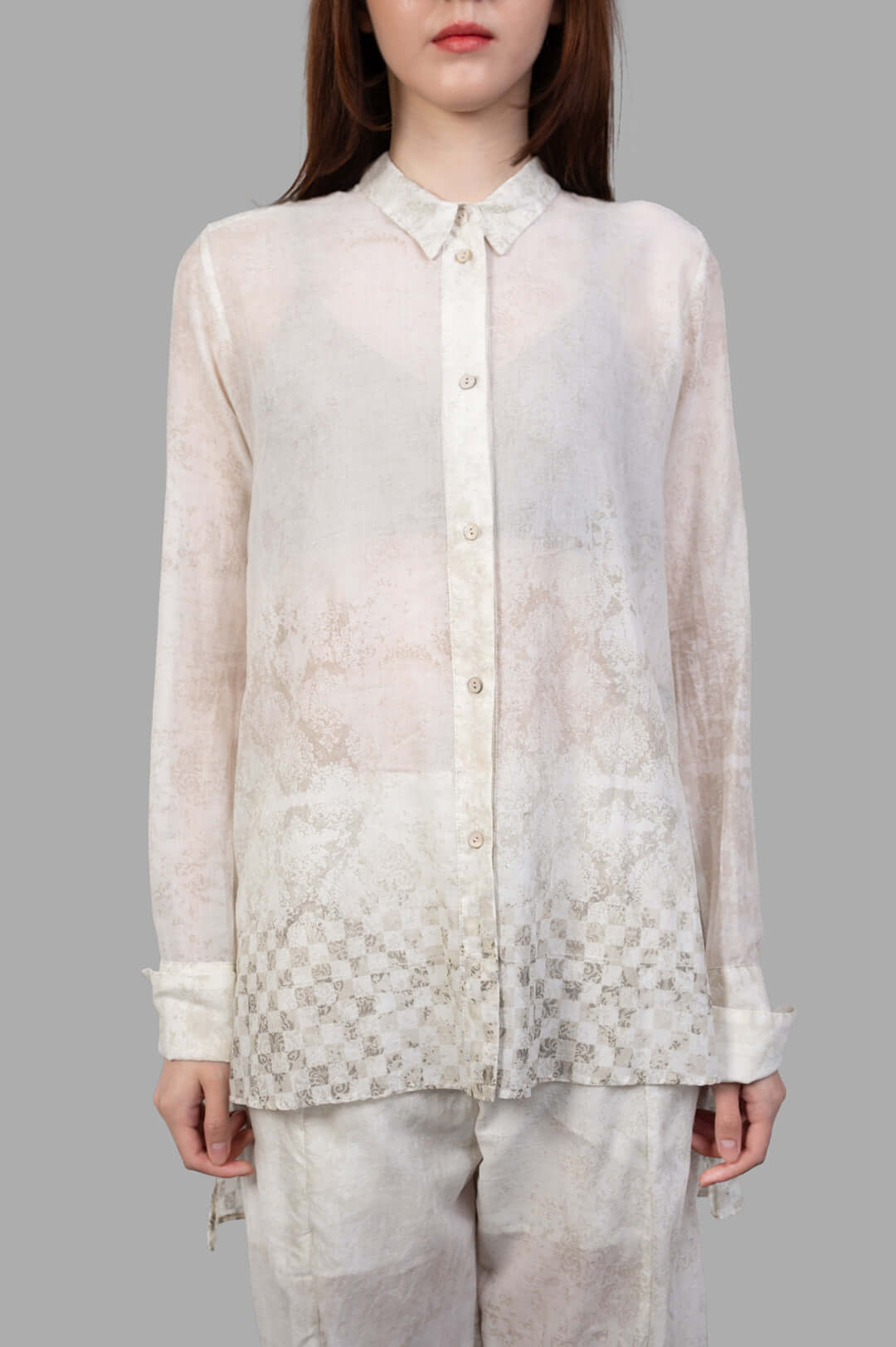 Masnada Plaster Shirt: Ecru, loose-fitting shirt with translucent fabric, subtle graphic detailing, model front view, 100%.