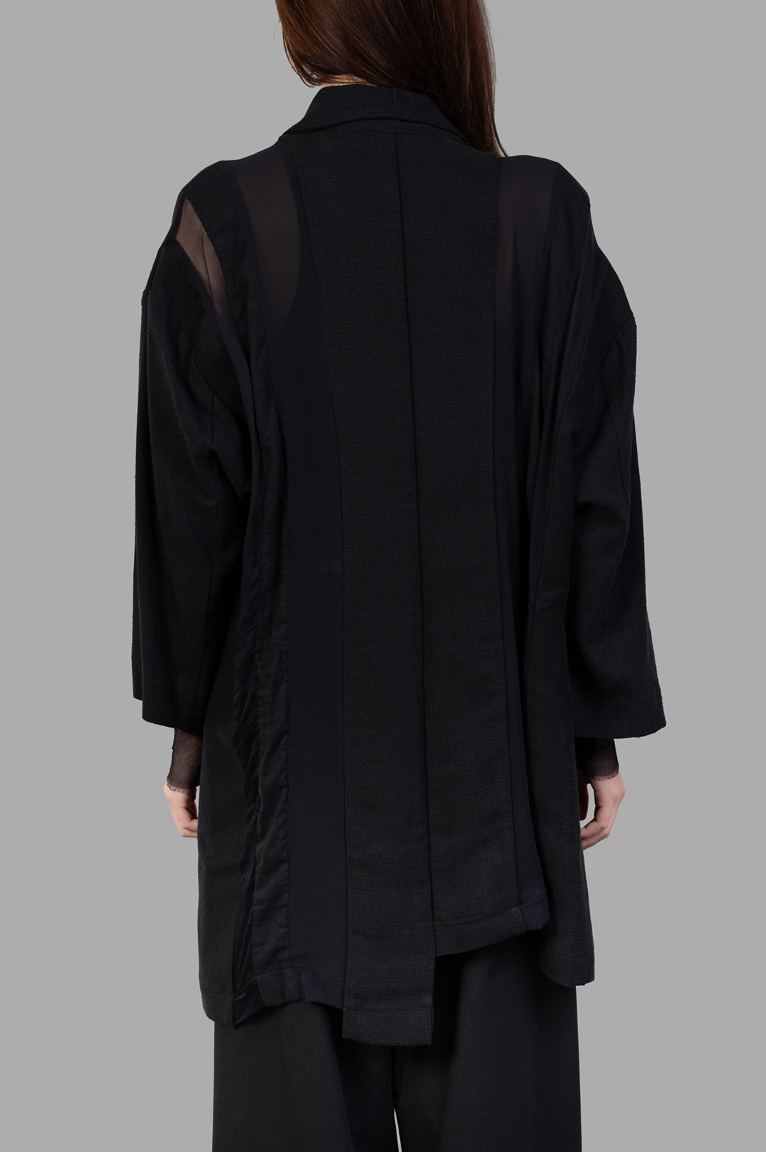 Giovanni Cavagna Paneled Blazer showcasing back detail with a blend of cotton and silk, offering a unique textured design.