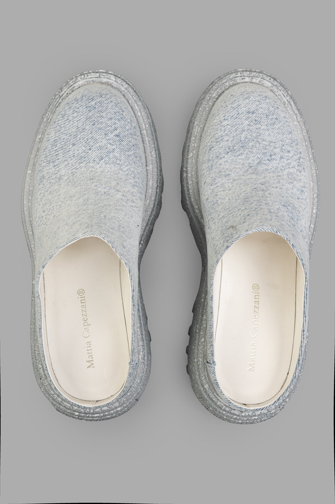 Mattia Capezzani Denim Mules, top view showcasing soft jeans fabric and textured leather soles, handcrafted in Italy.