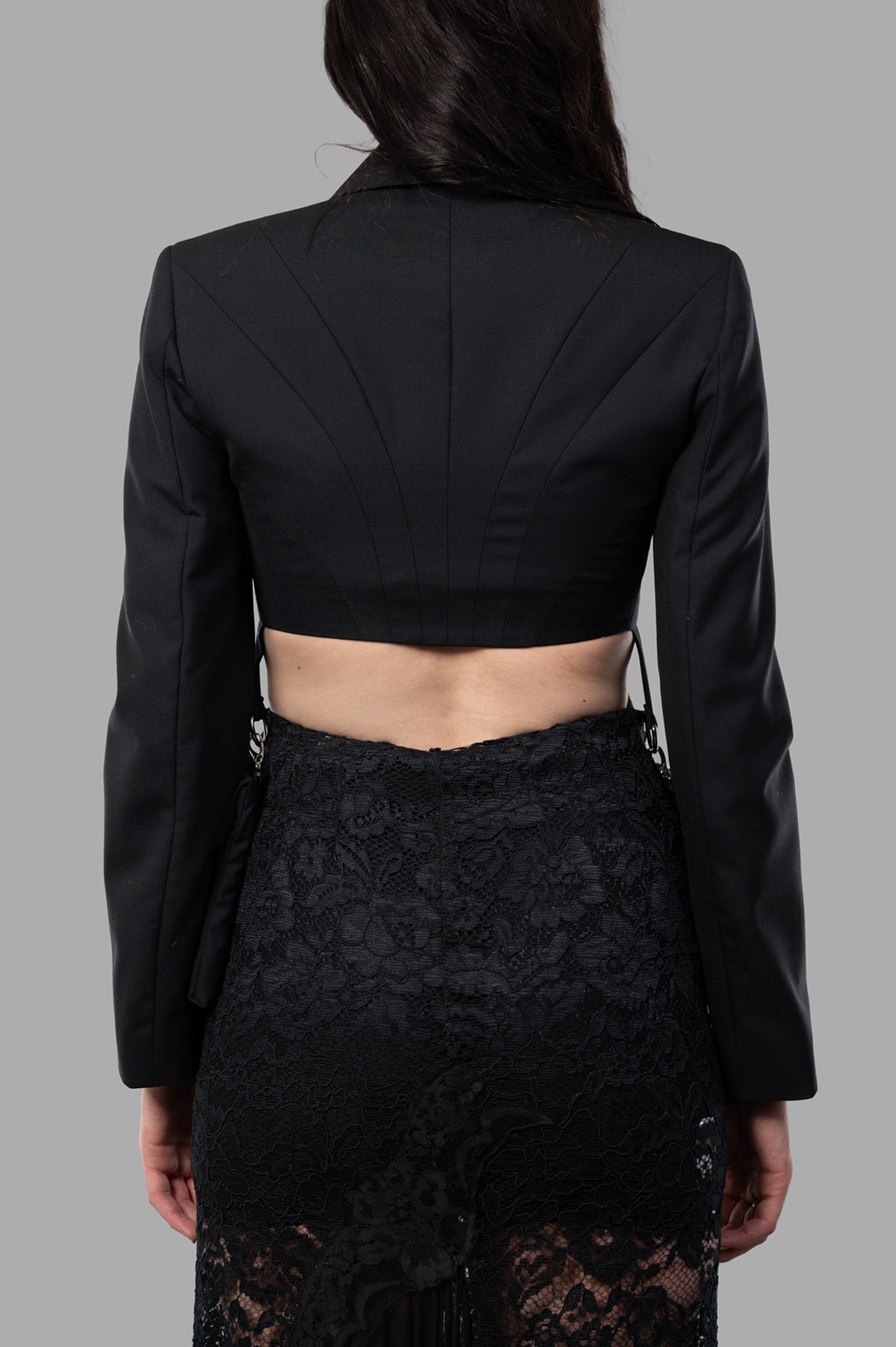 Sehnsucht Atelier Cropped Cargo Blazer, back view showing structured design and luxurious black wool fabric.