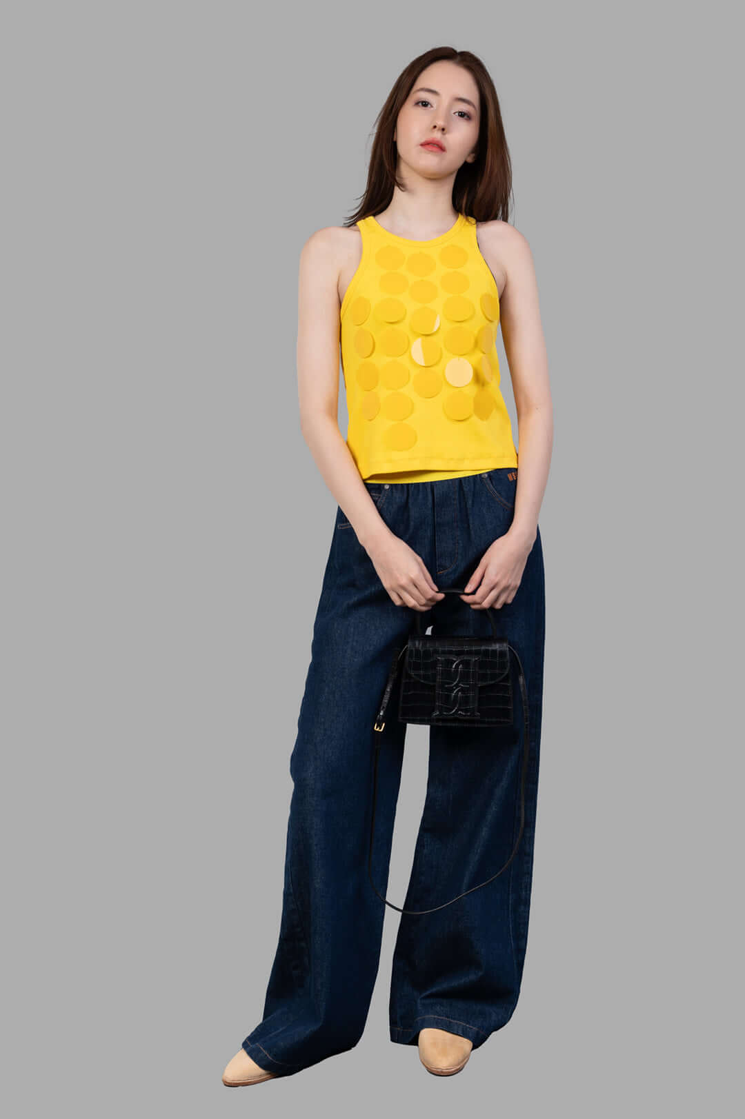 MSGM yellow Disc-embellished Tank Top on model, front view, featuring light-catching discs and flattering fit.