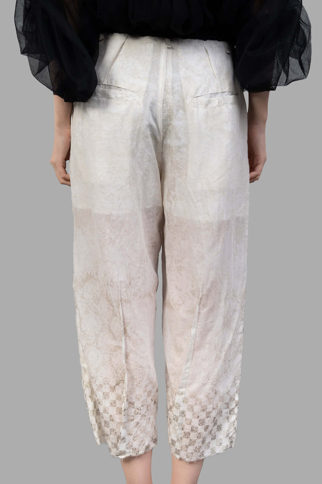 Masnada Cropped Trousers in ecru, showcasing a textured graphic design, elevated waistline, and straight-cut silhouette.