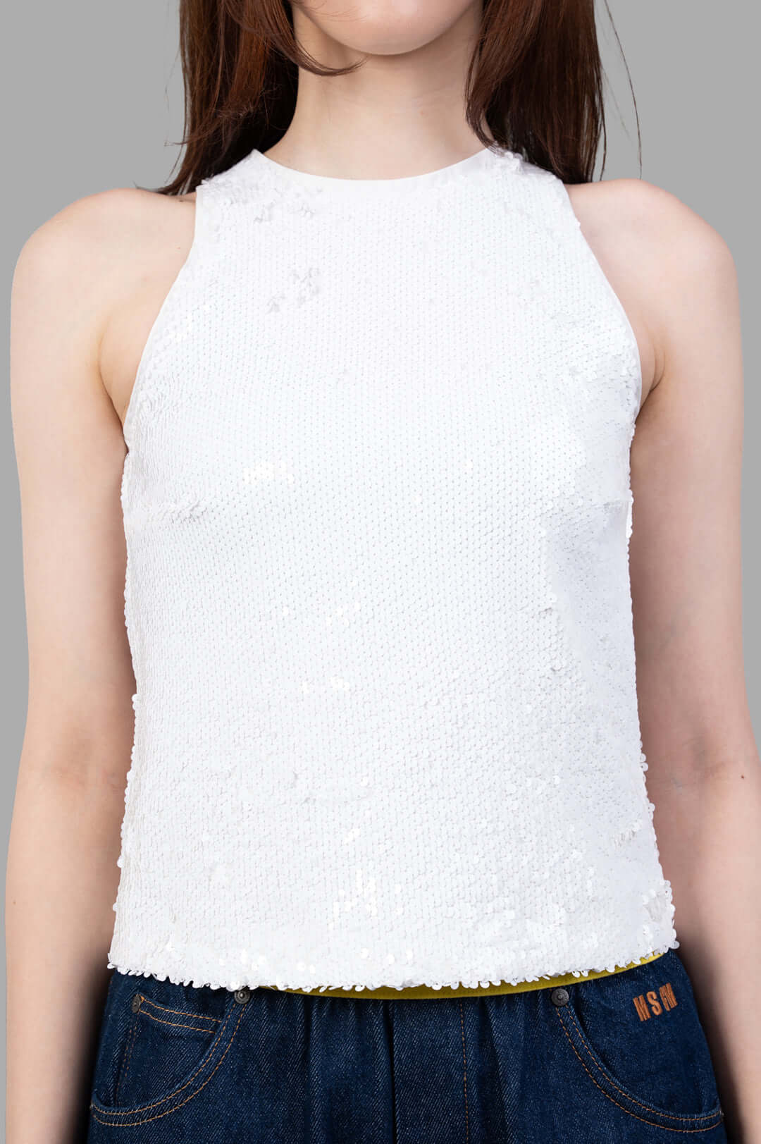 MSGM White Sequin Top, close-up view showcasing the textured fabric and vibrant sequins on a model, perfect for bold styling.