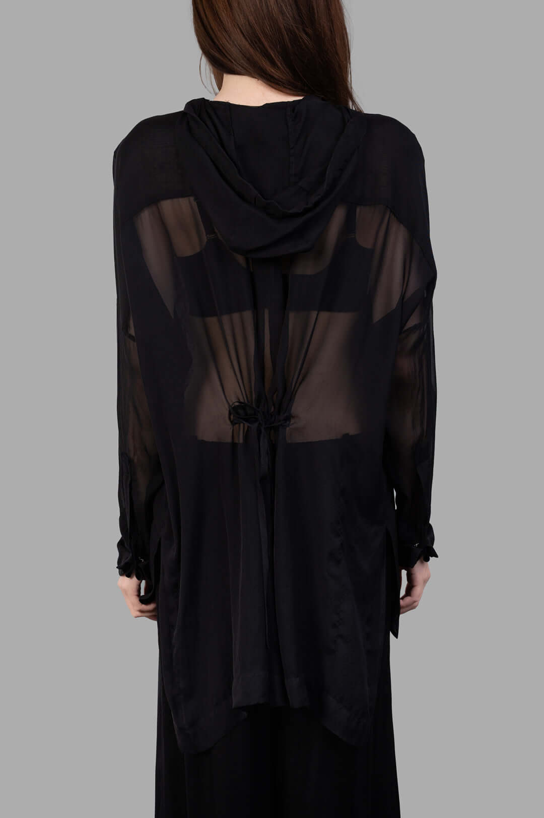 Masnada Hooded Shirt shown from the back, featuring a hood, drawstring, and sheer black silk fabric for a lightweight look.