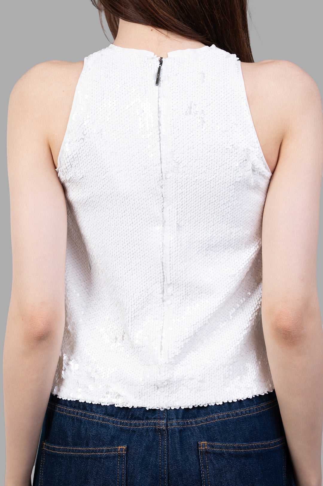 MSGM White Sequin Top showcased from the back, featuring a zip closure and shimmering sequin texture on a fitted silhouette.