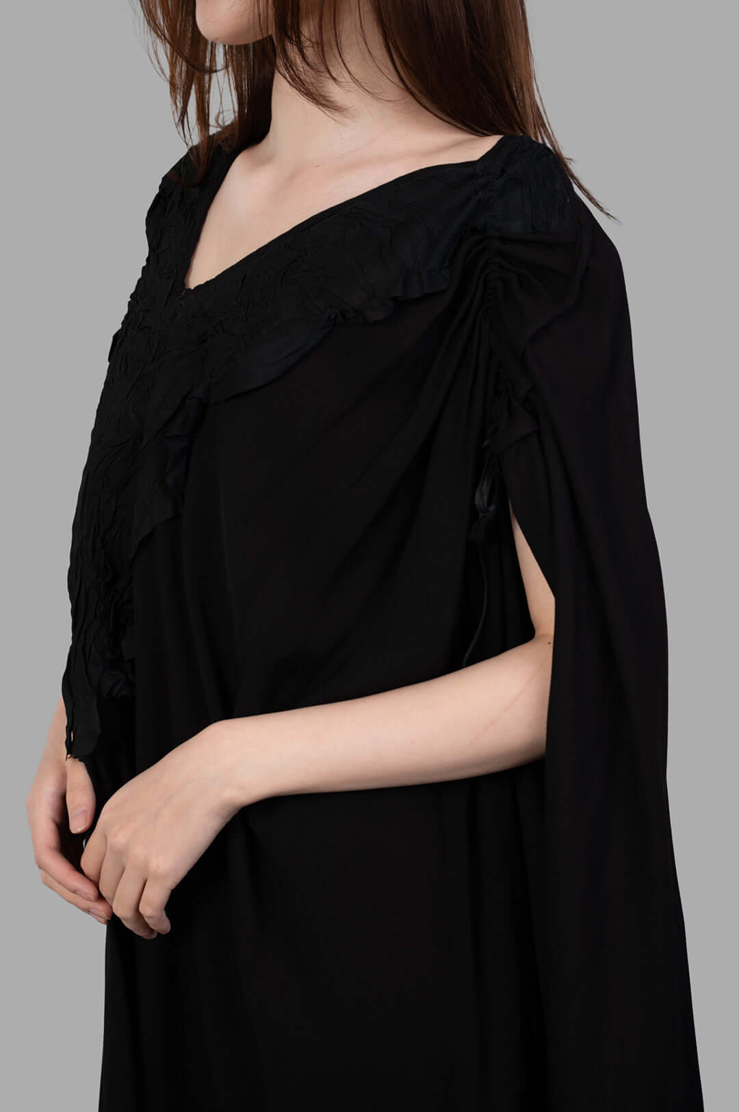 Isaac Sellam. Leather-detail Dress featuring a textured V-neck and stylish cap sleeves, showcasing black viscose and leather.