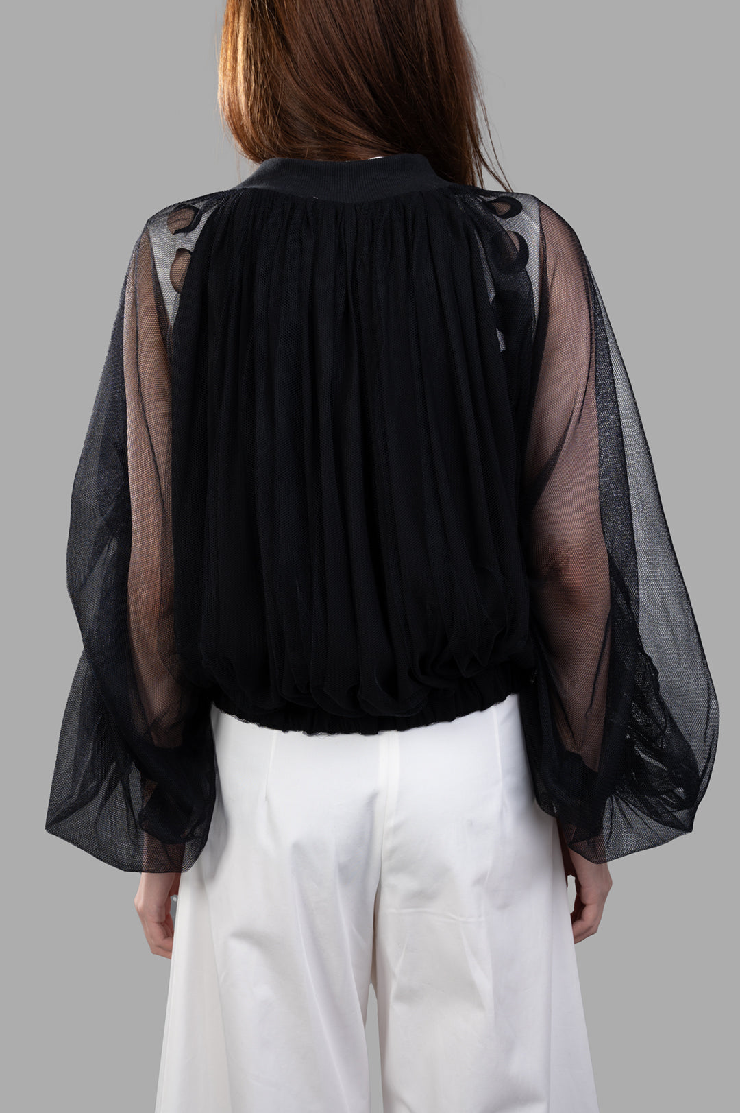 Giovanni Cavagna Mesh Bomber Jacket, black silk, back view highlighting sheer fabric and gathered hem detail.