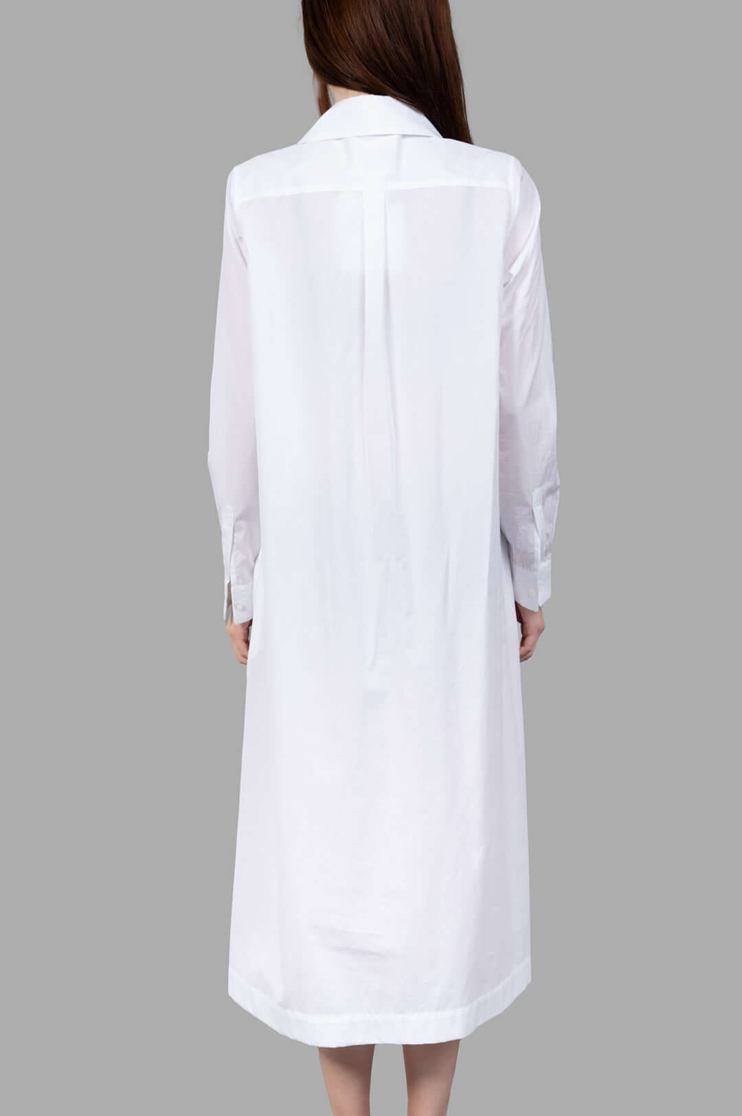 Noir Kei Ninomiya Charm-collar Shirt Dress, white with an exaggerated collar, showing buttons and long sleeves from the back.