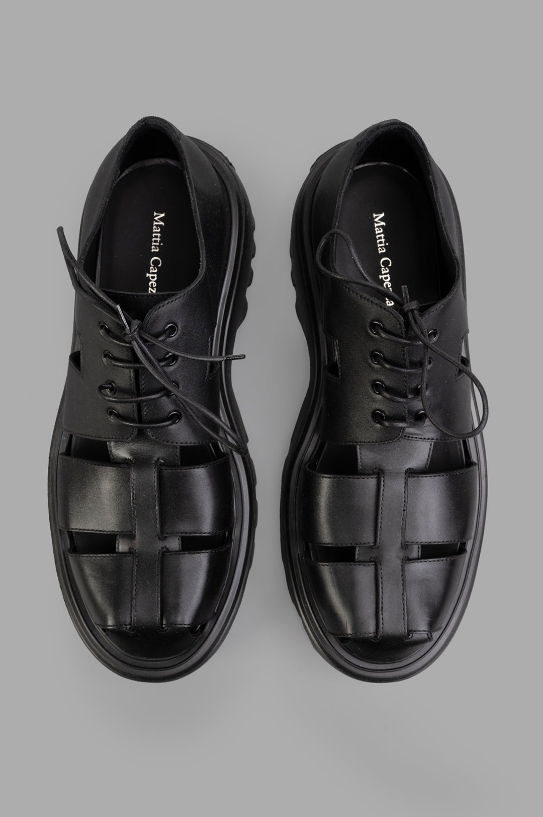 Mattia Capezzani Iron Black Shoes, top view showcasing the unique cut-out design and premium leather material.
