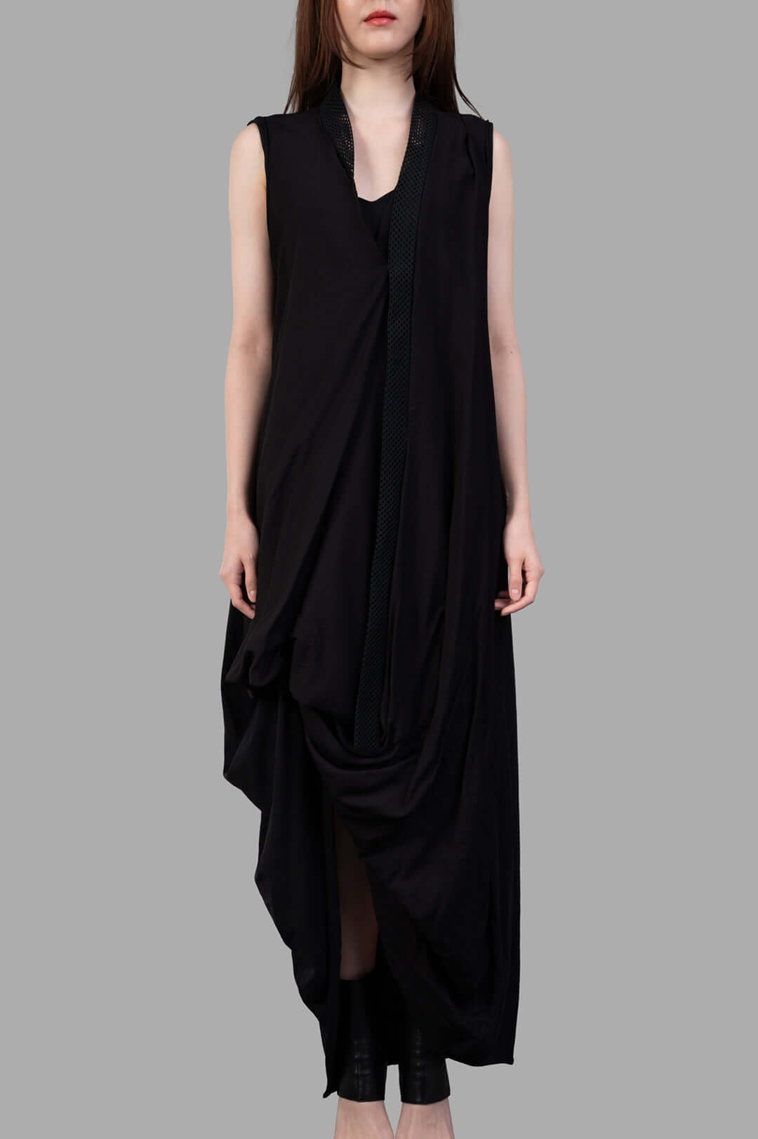 Giovanni Cavagna Asymmetric Dress in Black on model, showcasing a front view with unique draping and sleeveless design.