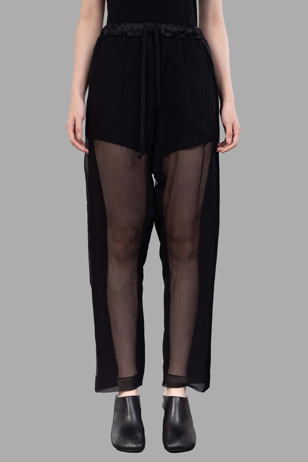 Giovanni Cavagna Semi-sheer Pants displayed on a model, featuring a relaxed fit with an elastic waistband and breathable.