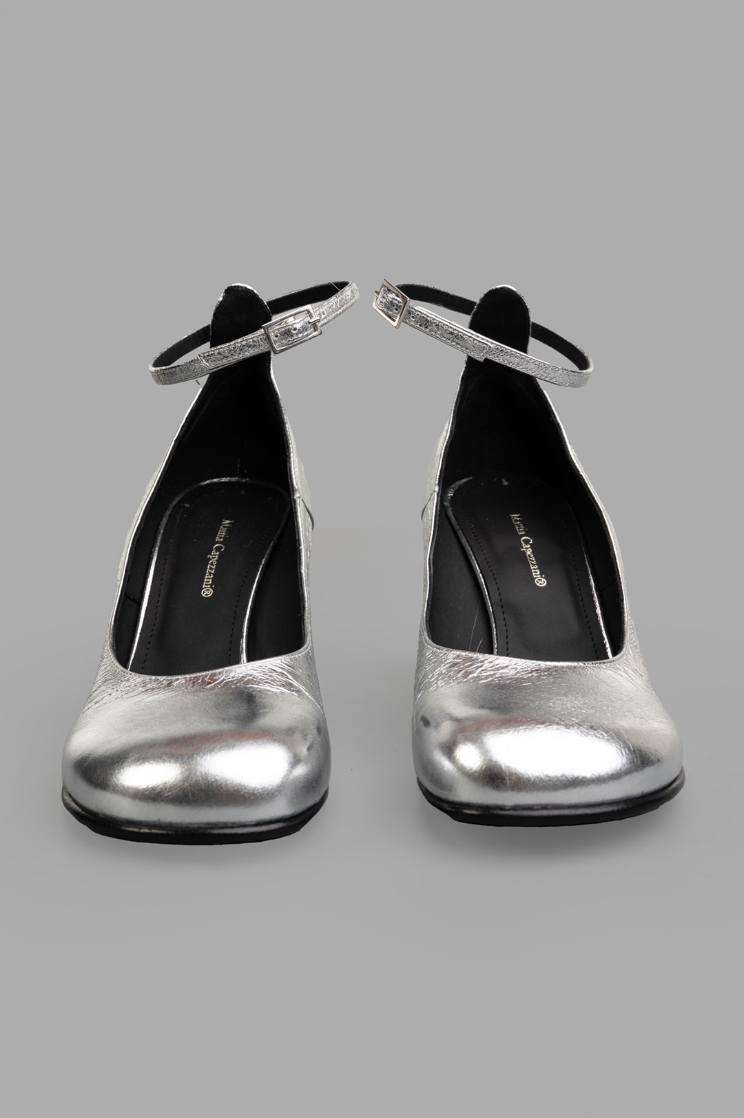 Mattia Capezzani Silver Heels feature a sleek silhouette with an ankle strap, showcasing 100% leather craftsmanship.