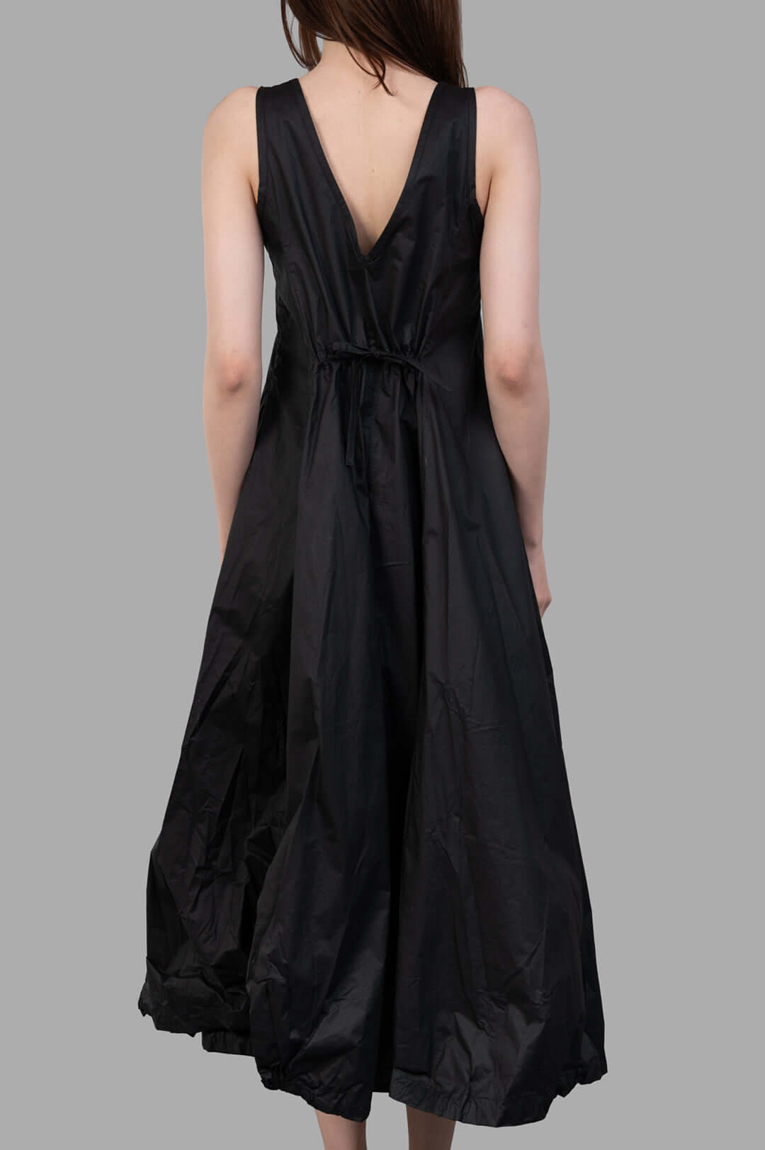 Masnada Balloon Dress viewed from the back, featuring a V-neckline and gathered waist for a voluminous silhouette.