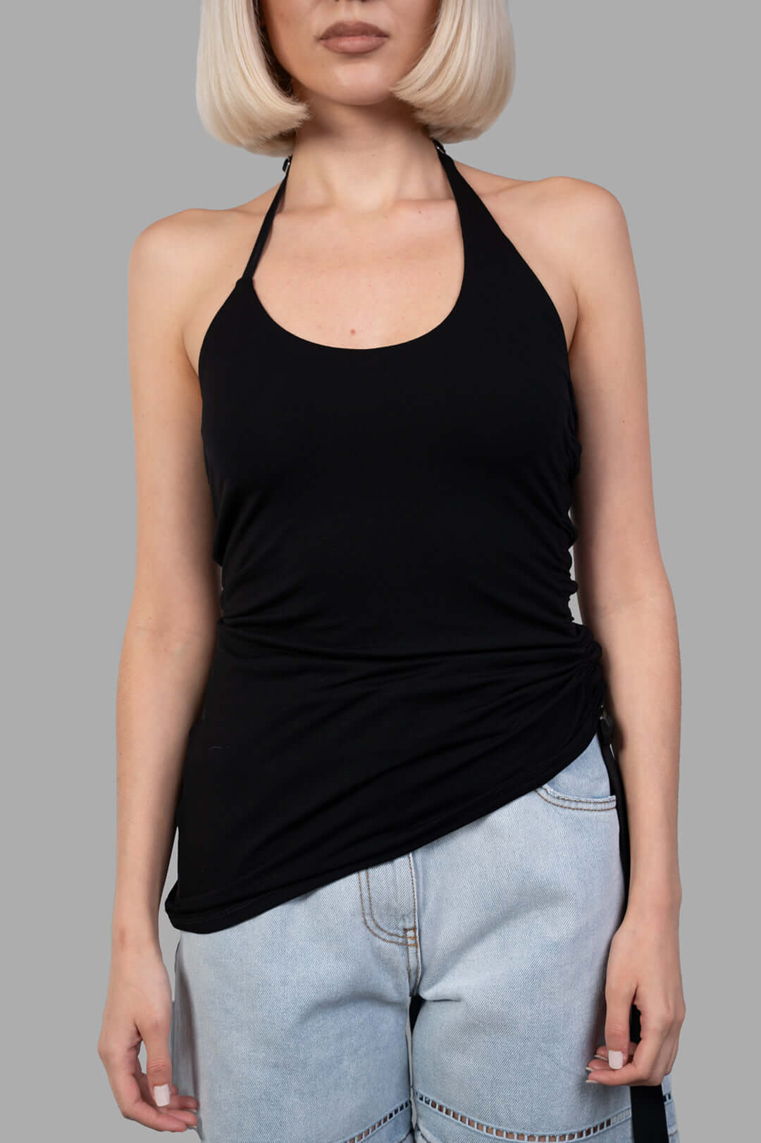 Helmut Lang Wind Harness Top showcases a black halter-neck style in soft lyocell jersey with a draped silhouette.