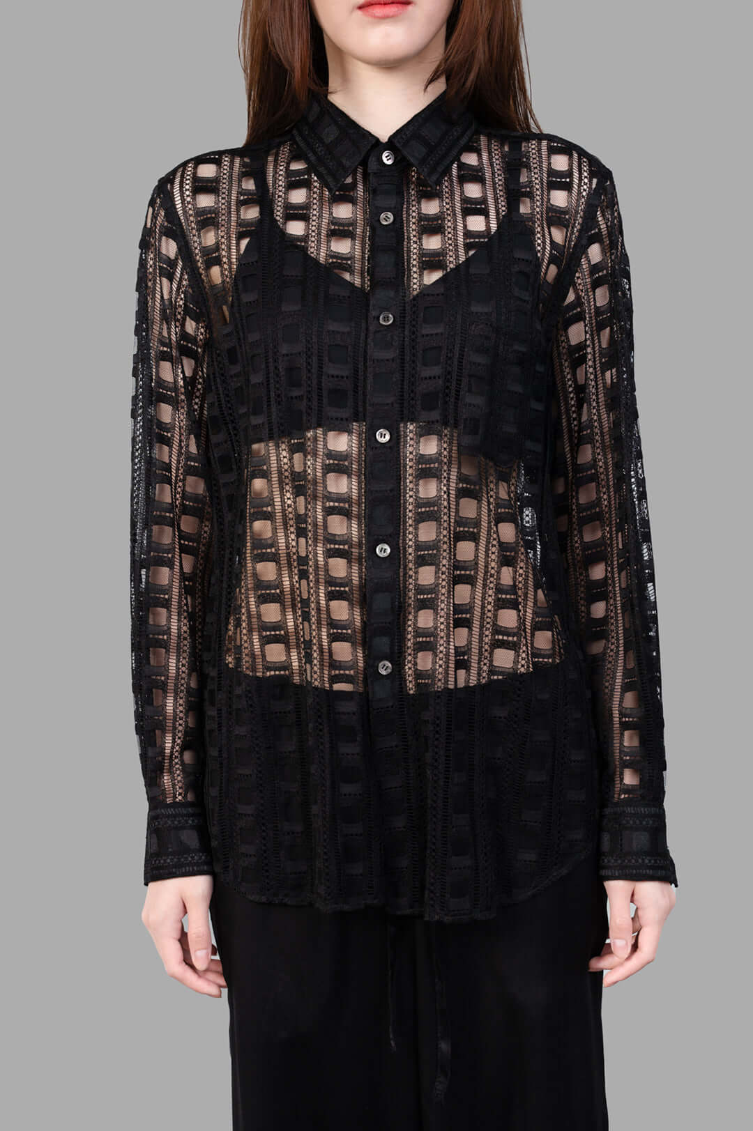 Comme des Garçons Embroidered Shirt in black, showcasing front button fastening and intricate details on-model.