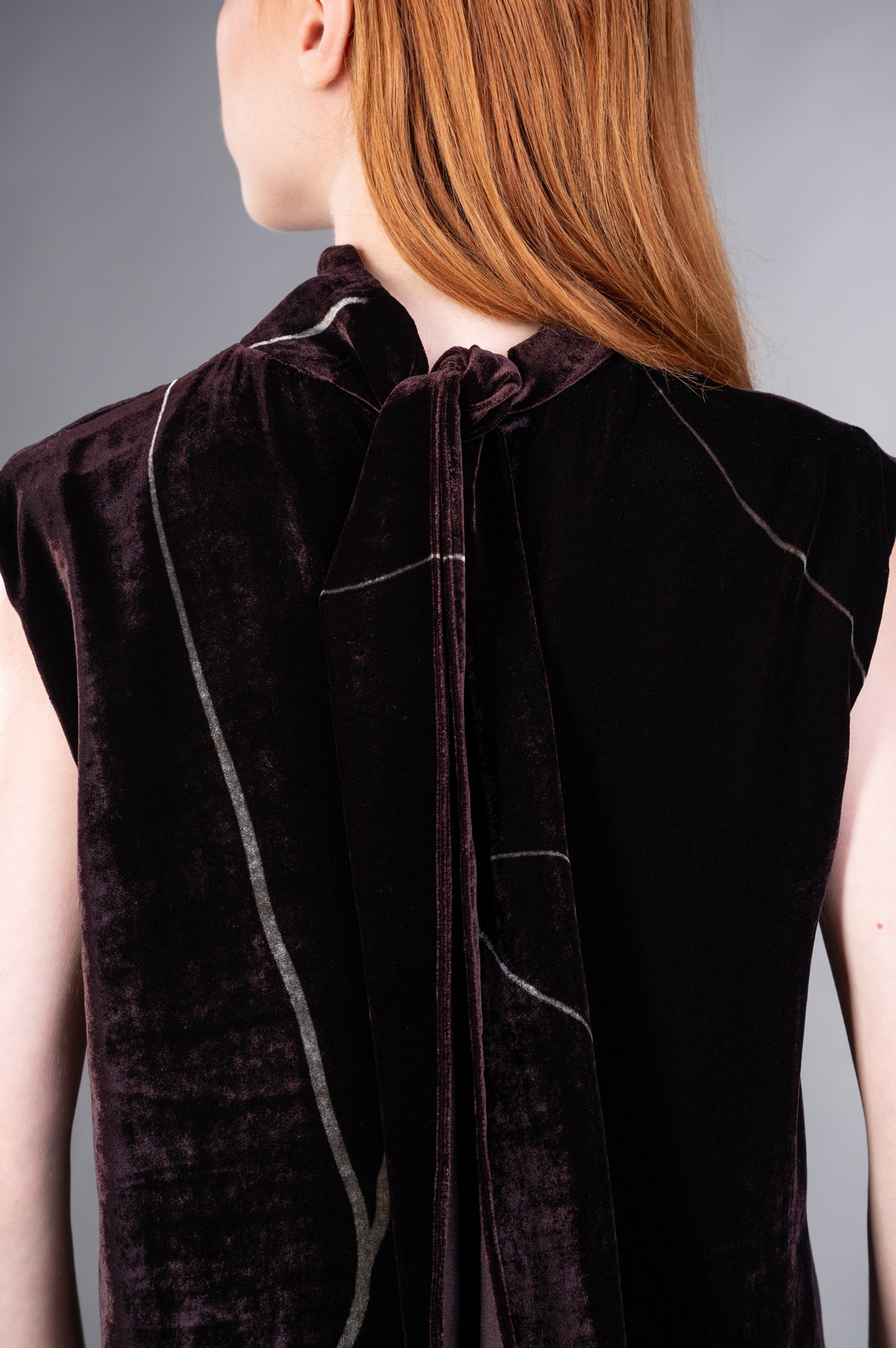 Gentry Portofino Velvet Dress showcases a back view with a stylish tie detail and soft burgundy velvet texture.