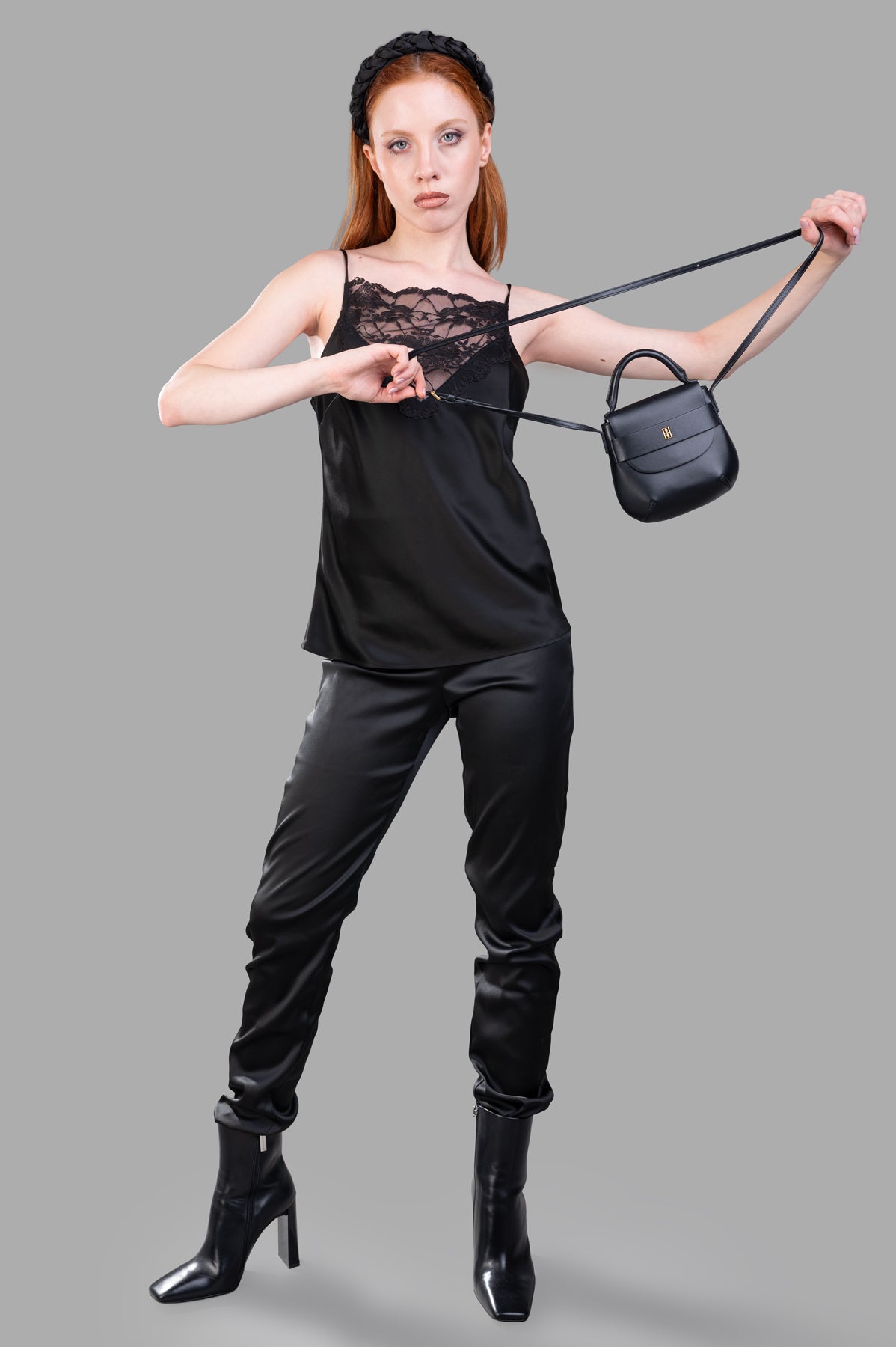 Giovanni Cavagna Satin Trousers, black cigarette style modeled, highlighting high-waist and luxury smooth satin fabric.