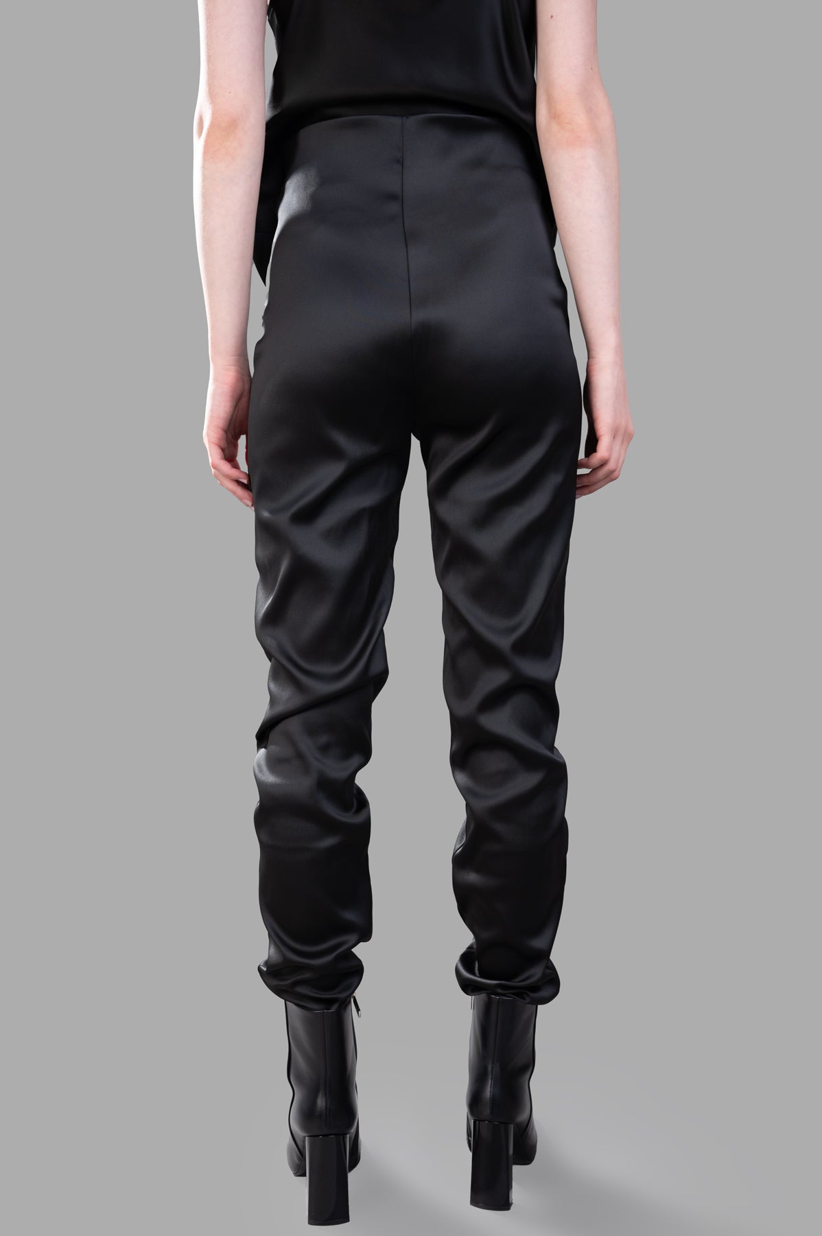 Giovanni Cavagna Satin Trousers, high-waisted black design shown from the back, featuring luxurious smooth fabric.