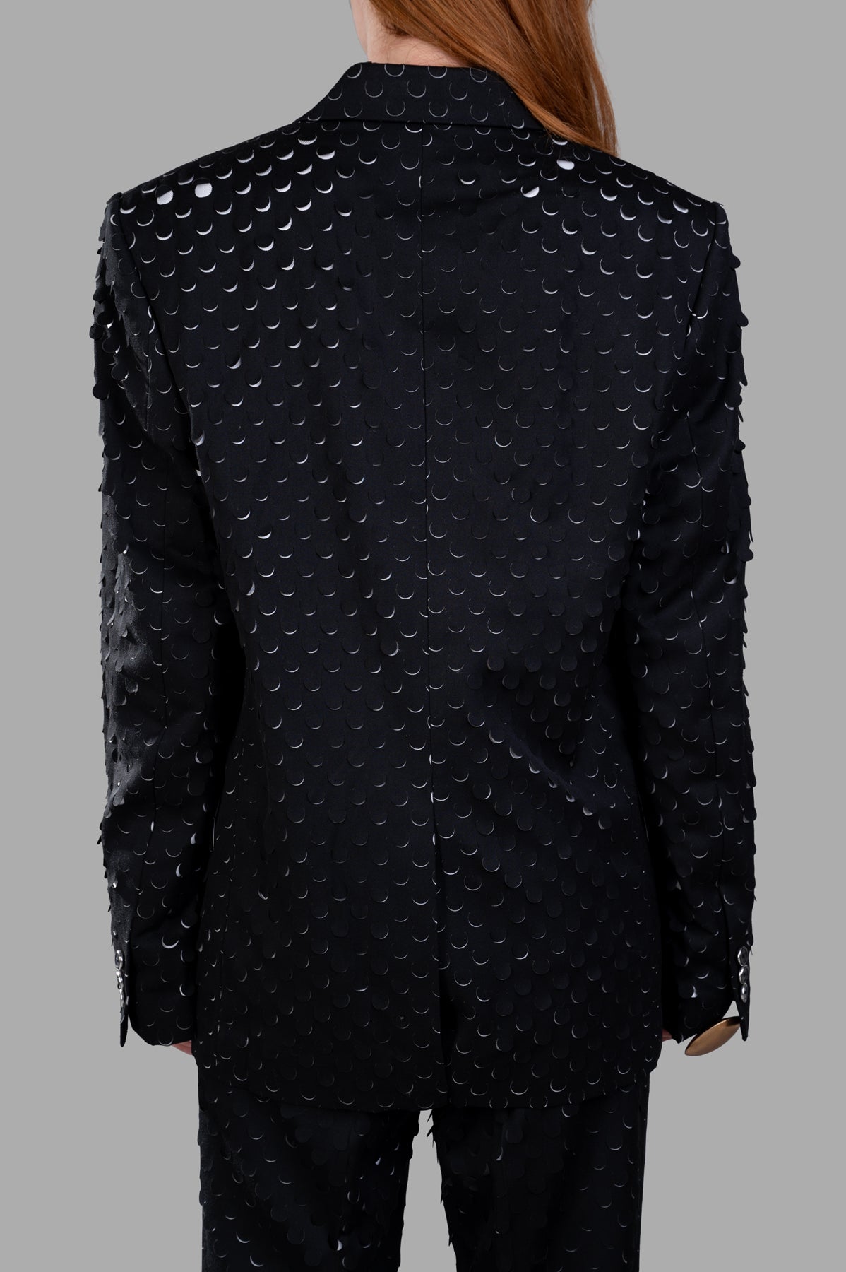 Helmut Lang Hole-Punched Car Blazer, showcasing back view with unique hole-punch texture and relaxed fit in black.