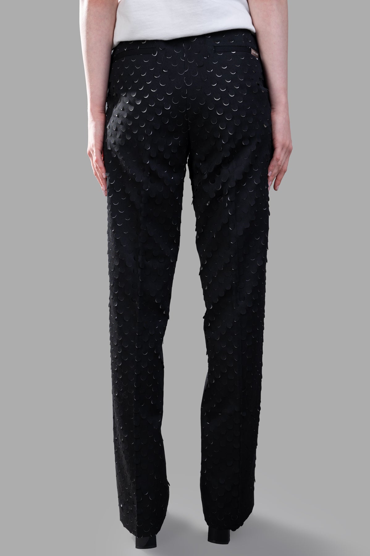 Helmut Lang Hole-Punched Car Trousers, black, showcasing unique laser-cut back detail and relaxed straight-leg fit.