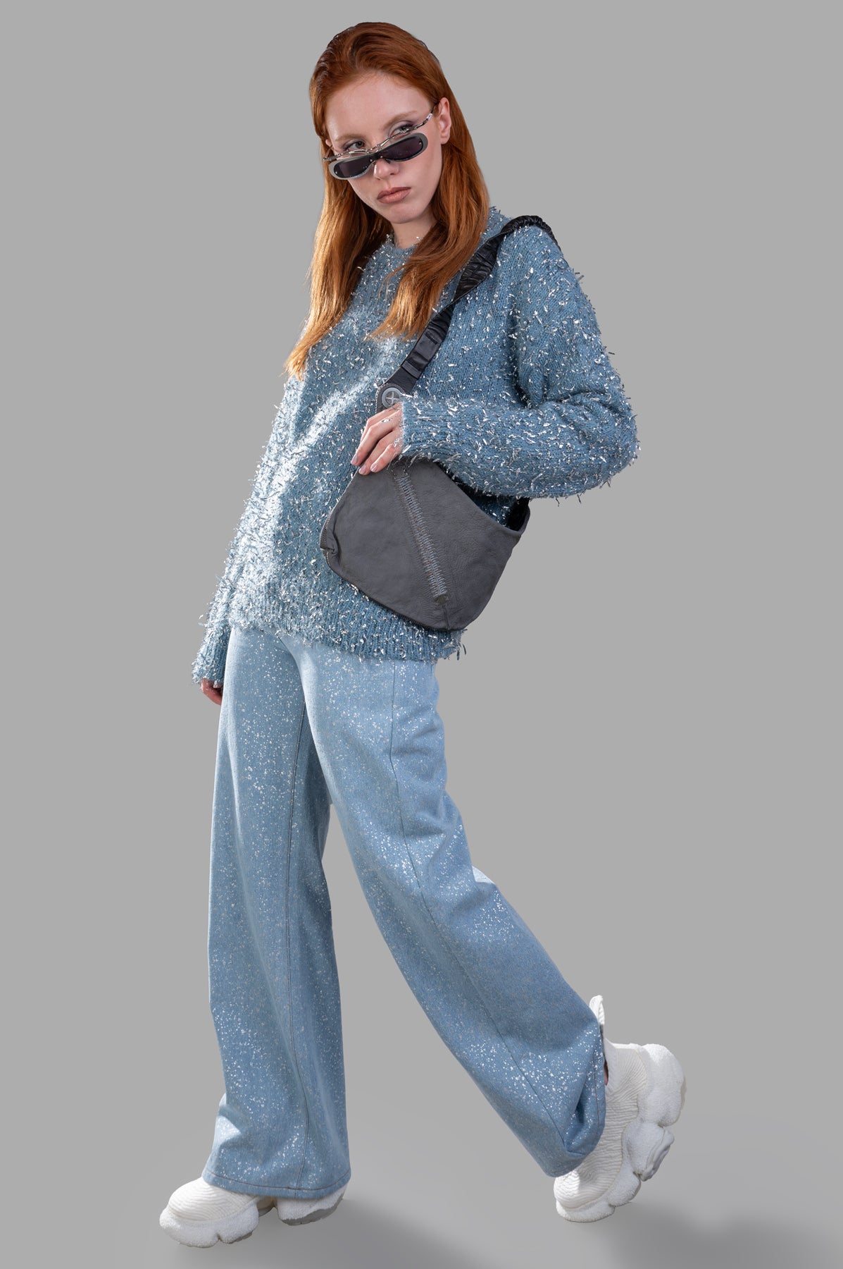 MSGM Lamé Thread Sweater in blue, worn as a front-view. Features frayed silver texture, ribbed details, and regular fit.