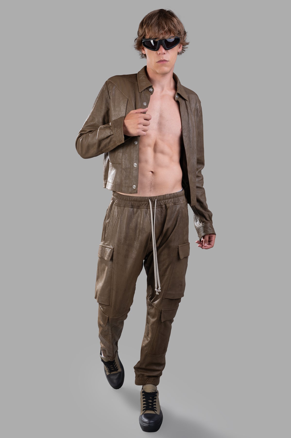 Rick Owens Porterville Mastodon Pants in green lamb leather with cargo pockets, slim fit on model, front view.
