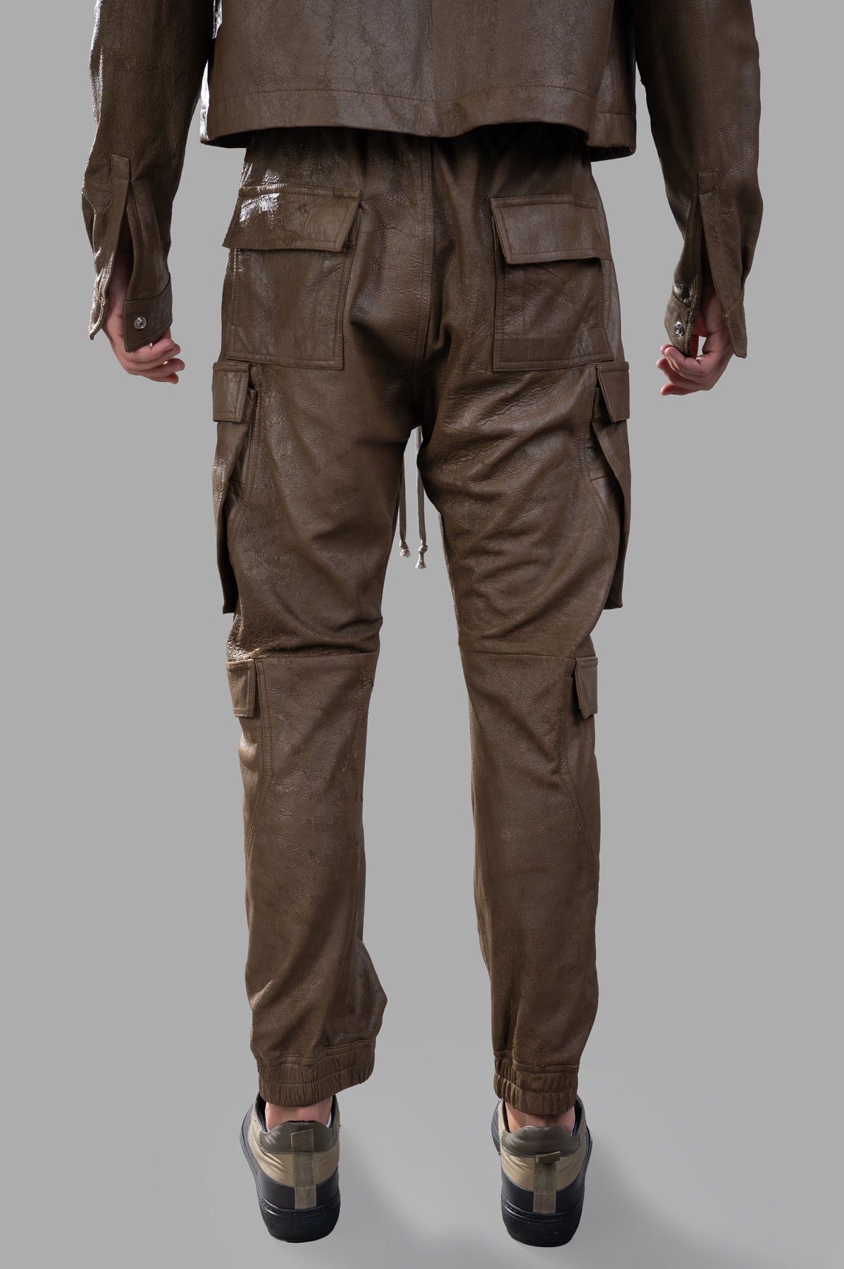 Rick Owens Porterville Mastodon Pants shown from the back, featuring cargo pockets and elasticated ankles in textured lamb.
