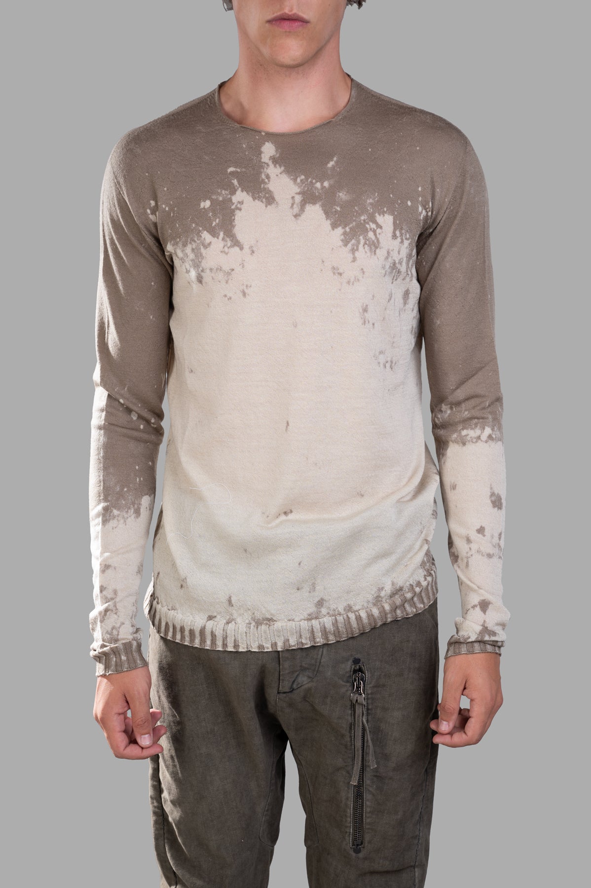 MD 75 Gradient Jumper in beige, showcasing unique earthy gradient design and textured wool fabric, model front view.