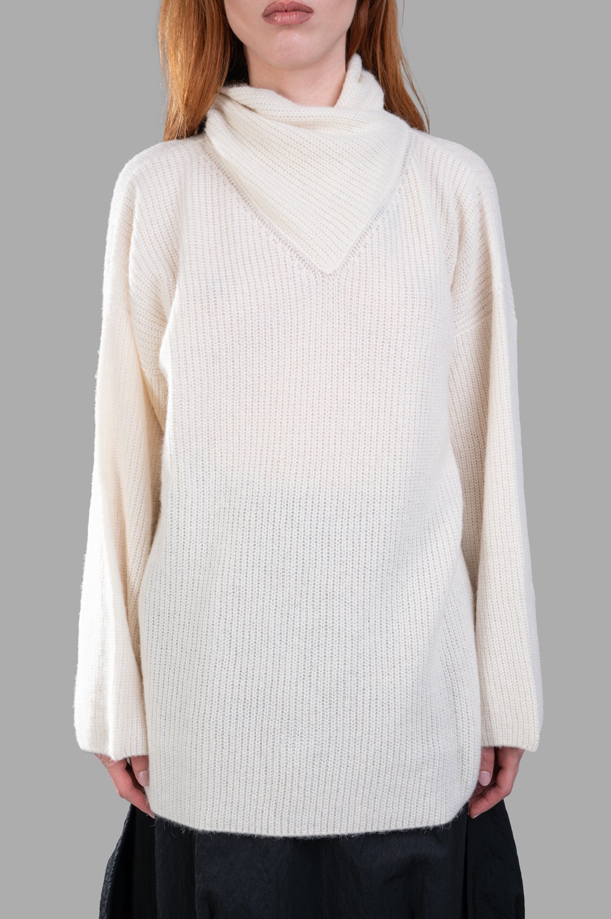 Gentry Portofino Cream Sweater showcases a cozy knit fabric with an asymmetric turtleneck in soft white, perfect for modern style.