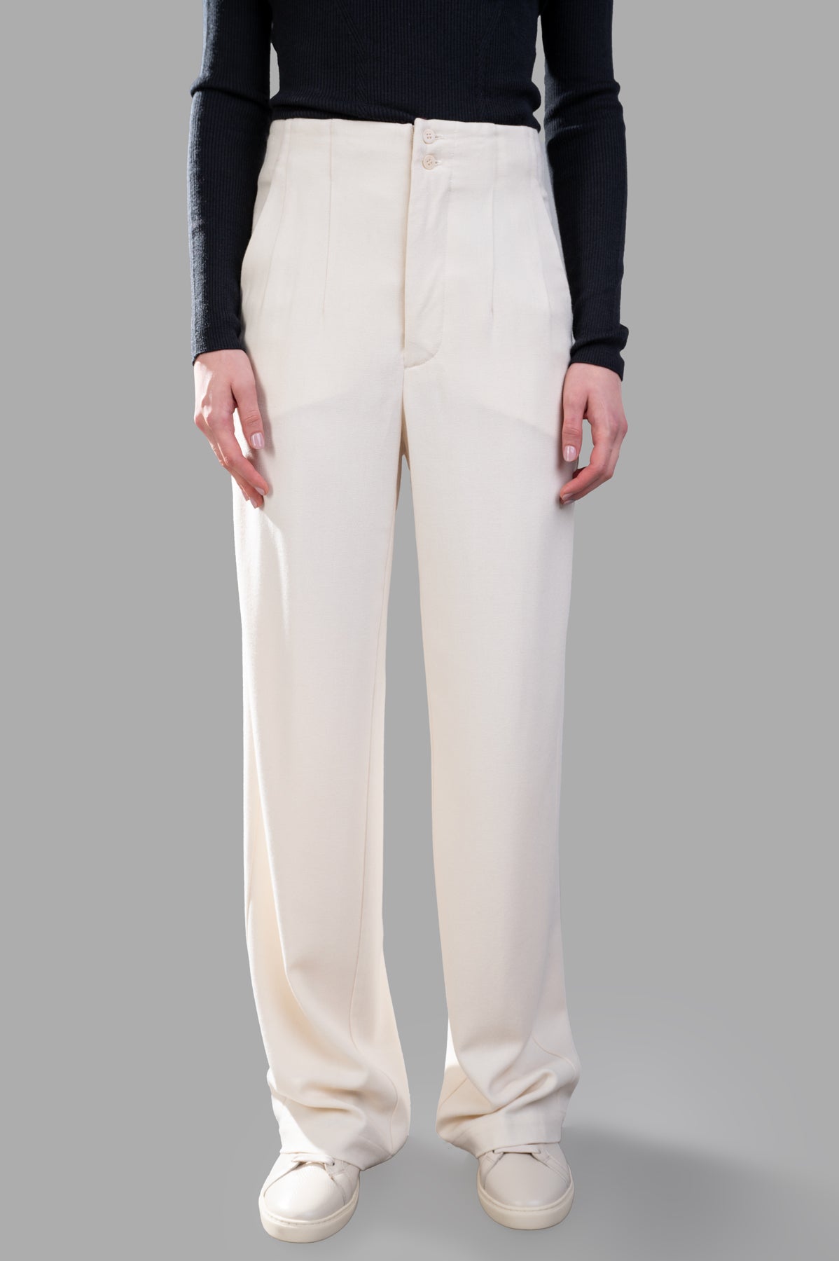 Gentry Portofino Pleated Trousers in ecru, featuring a wide-legged design with front pleats and side pockets, worn on model.
