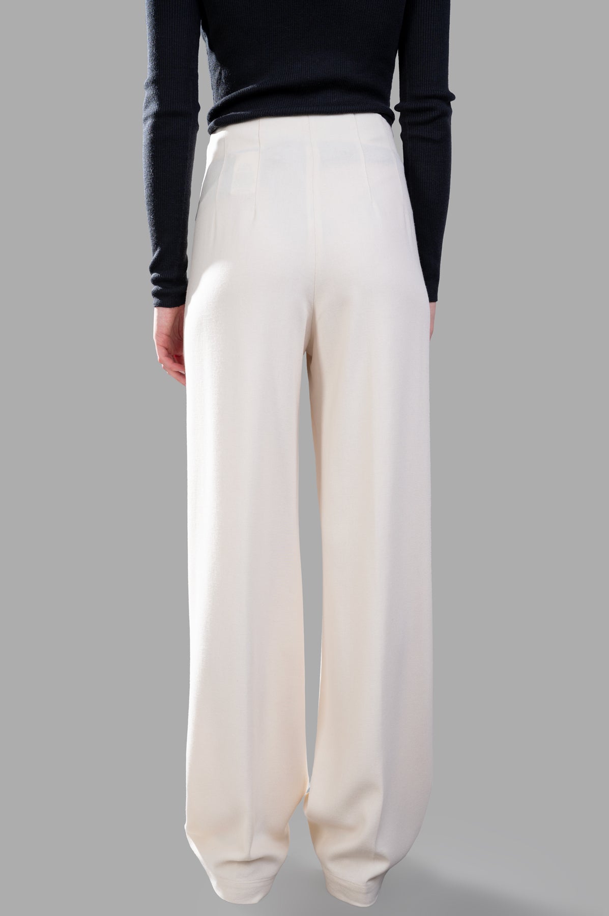 Gentry Portofino Pleated Trousers in ecru, showcasing back view with wide legs and elegant front pleats.