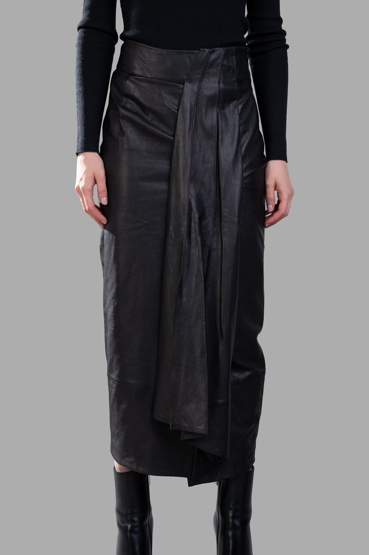 Gentry Portofino Leather Pencil Skirt featuring a high-waisted design and asymmetric pleating, showcased on model.