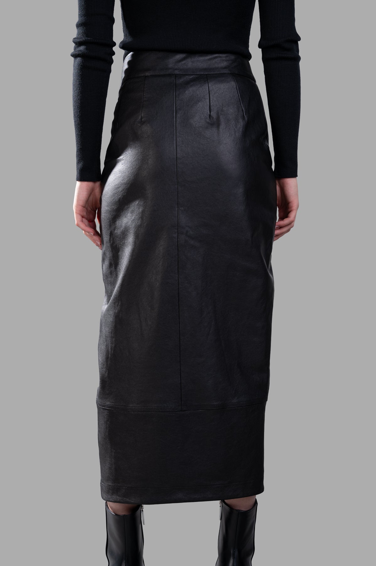 Gentry Portofino Leather Pencil Skirt, high-waisted black leather, showcasing back detail and sleek silhouette on model.
