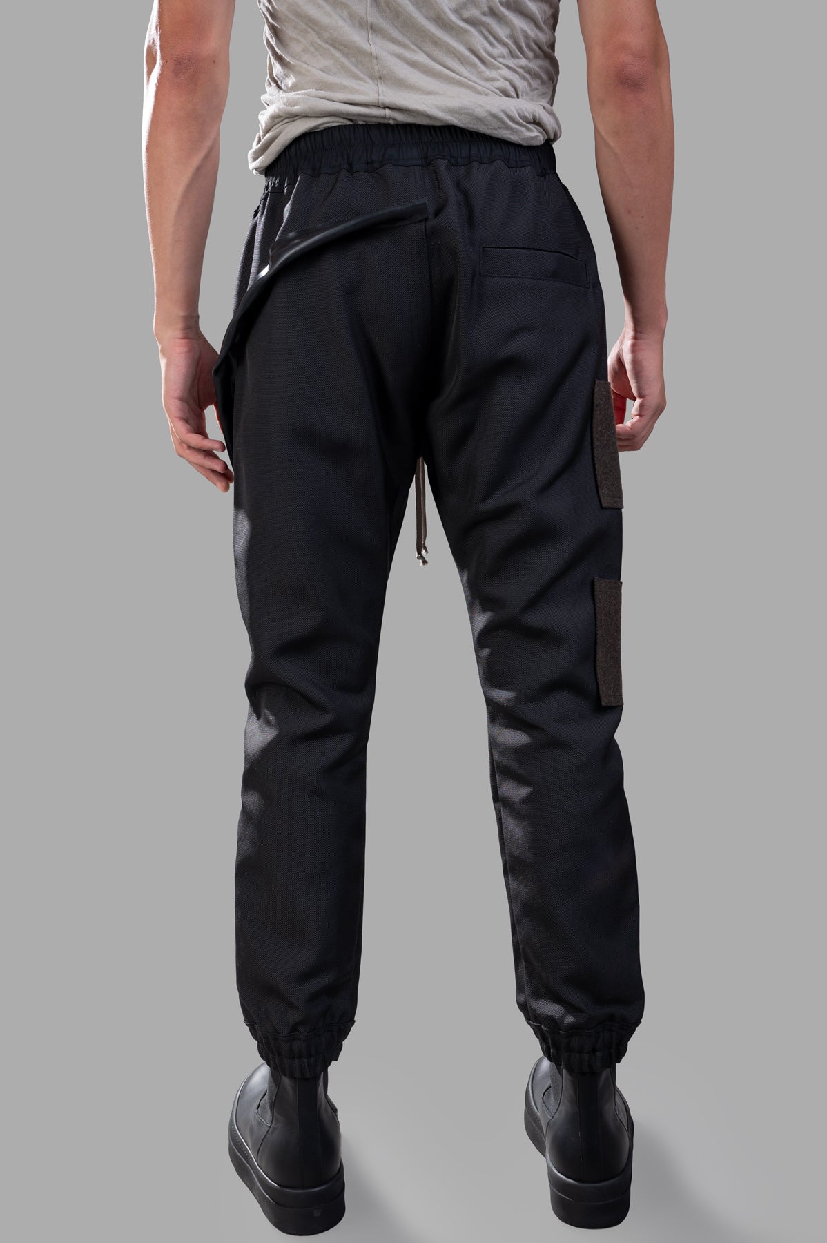 Rick Owens Porterville Mastodon Megacargo Pants, black, full-length with elasticized waistband and cargo pocket details.