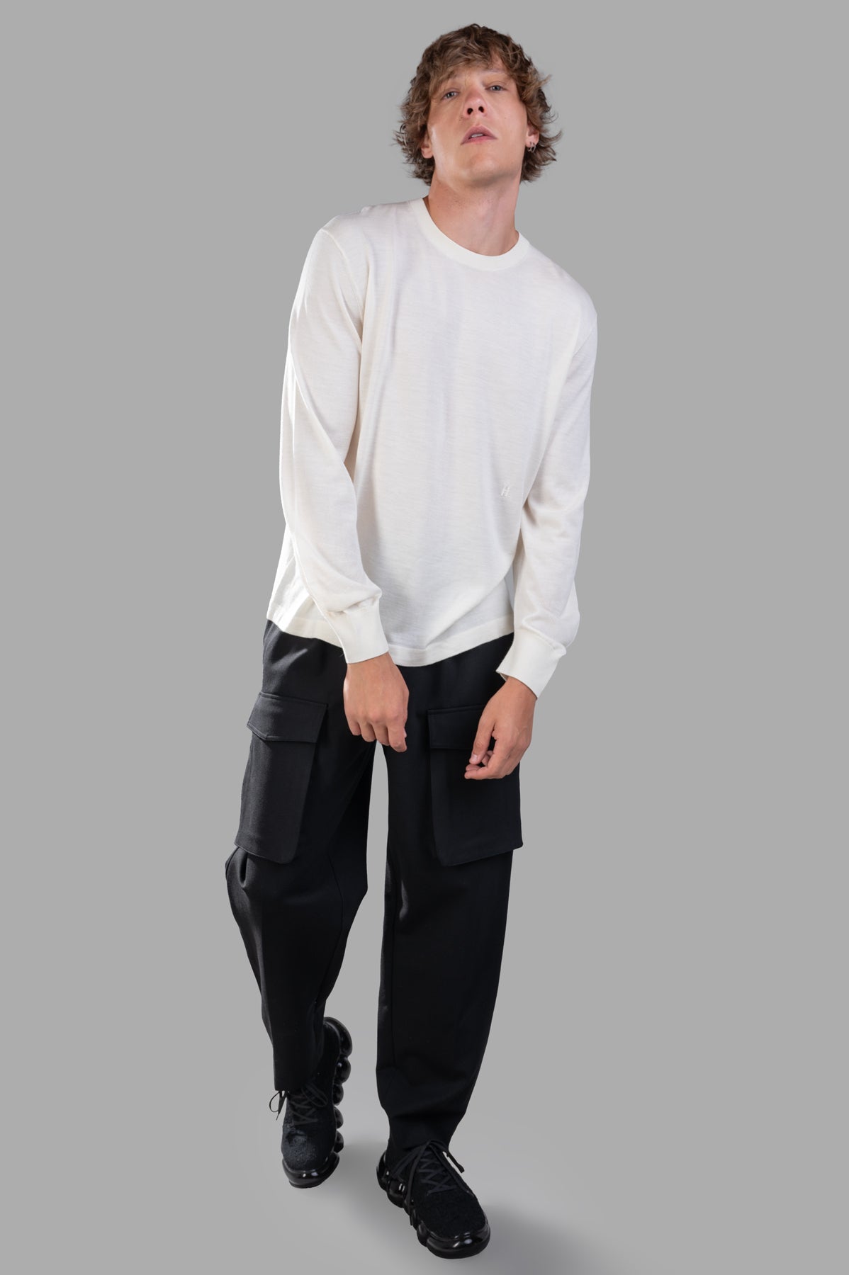 Helmut Lang Curved Sleeve Sweater in ivory, front view on-model, crew neck, Merino Wool Silk blend, cuffed sleeves.
