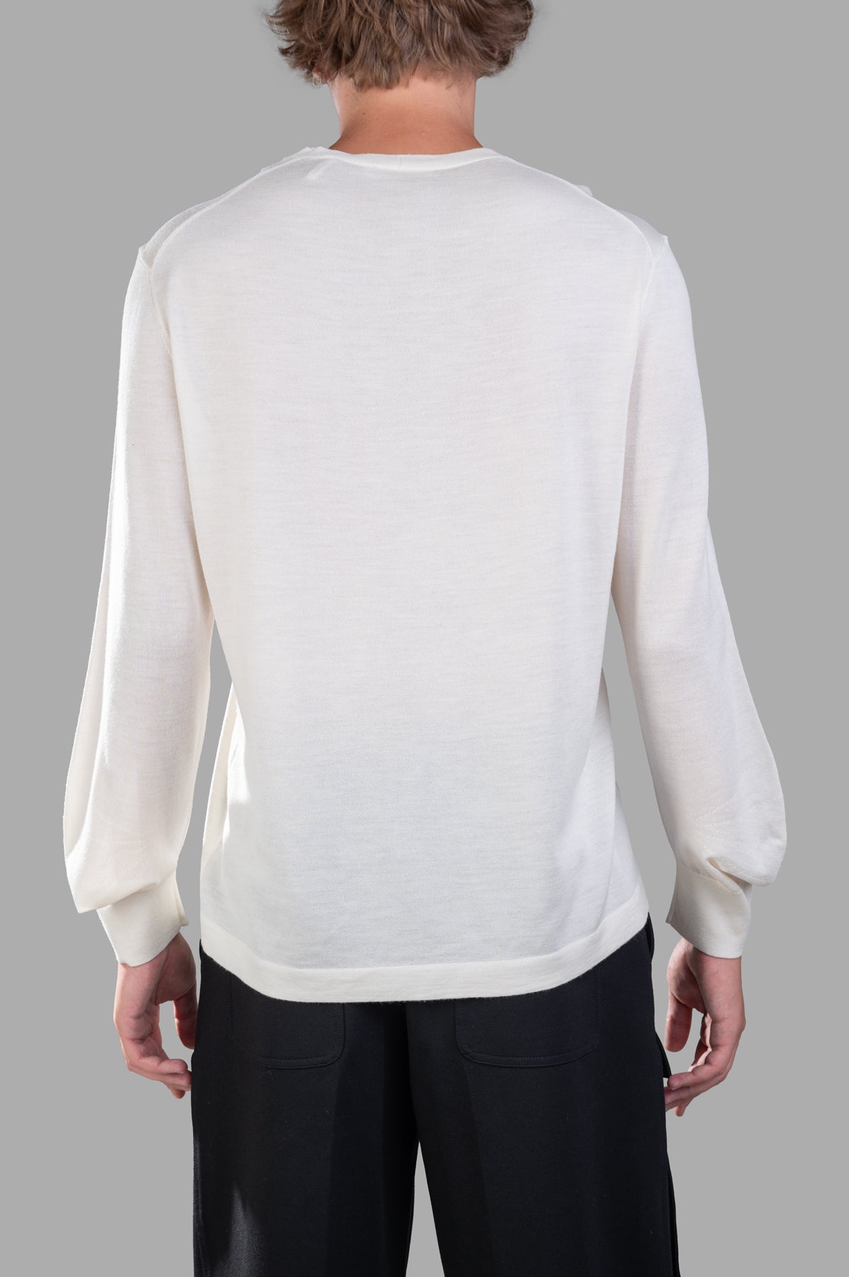 Helmut Lang Curved Sleeve Sweater in ivory, featuring unique elbow-length sleeves and soft Merino Wool Silk blend texture.