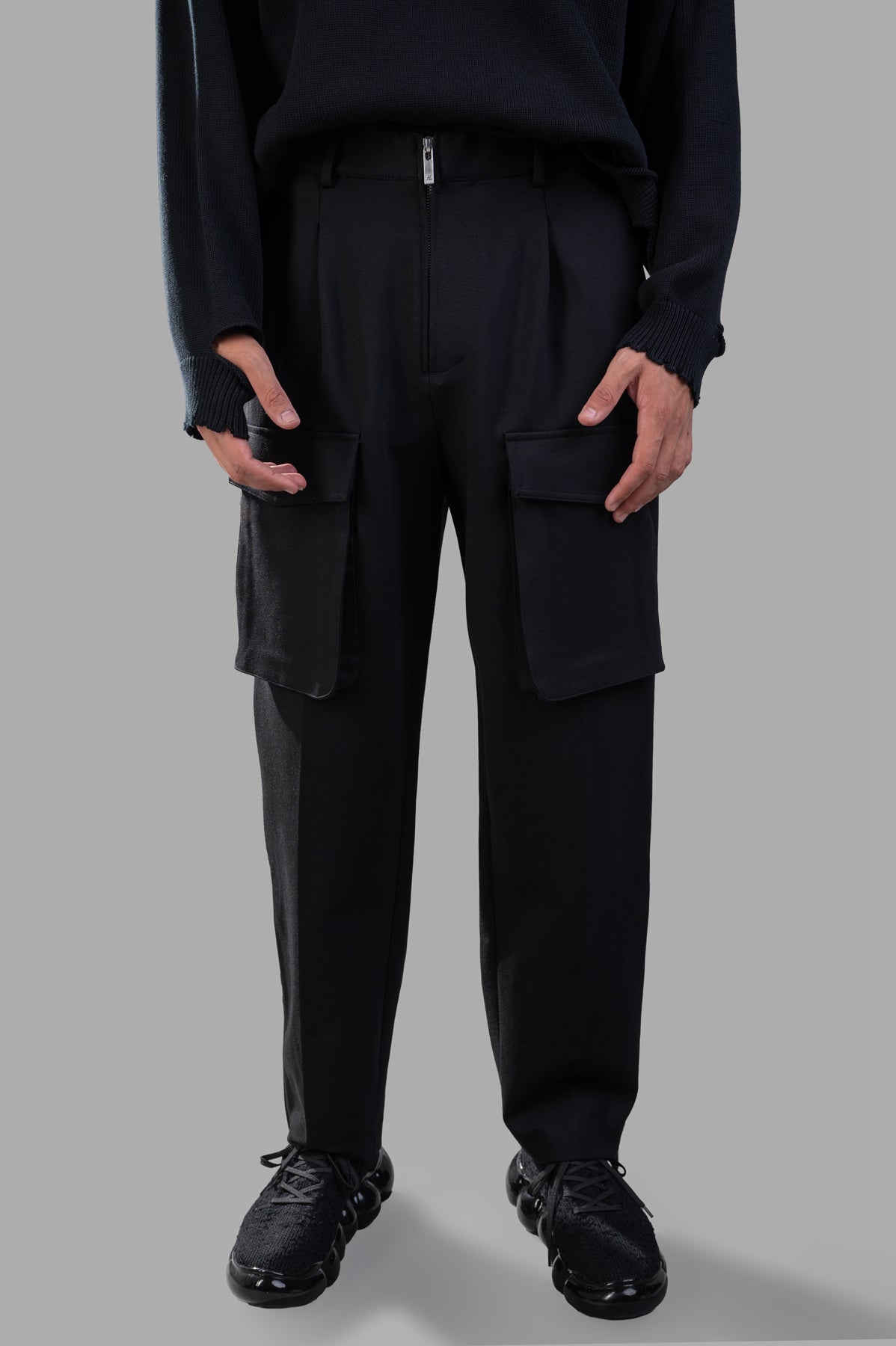 Helmut Lang Pocket Zoot Pants displayed front view, featuring utility flap pockets, zip closure, and relaxed fit. Color.